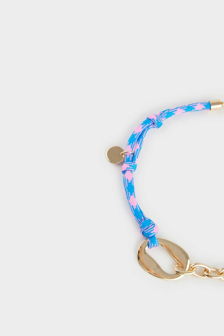 Collier doré avec corde bleue pour femme