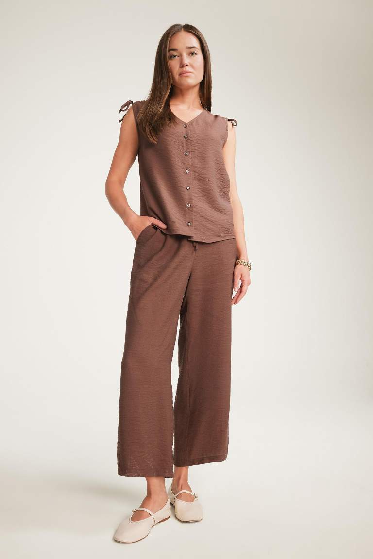 Blouse froncée sans manches à col en V