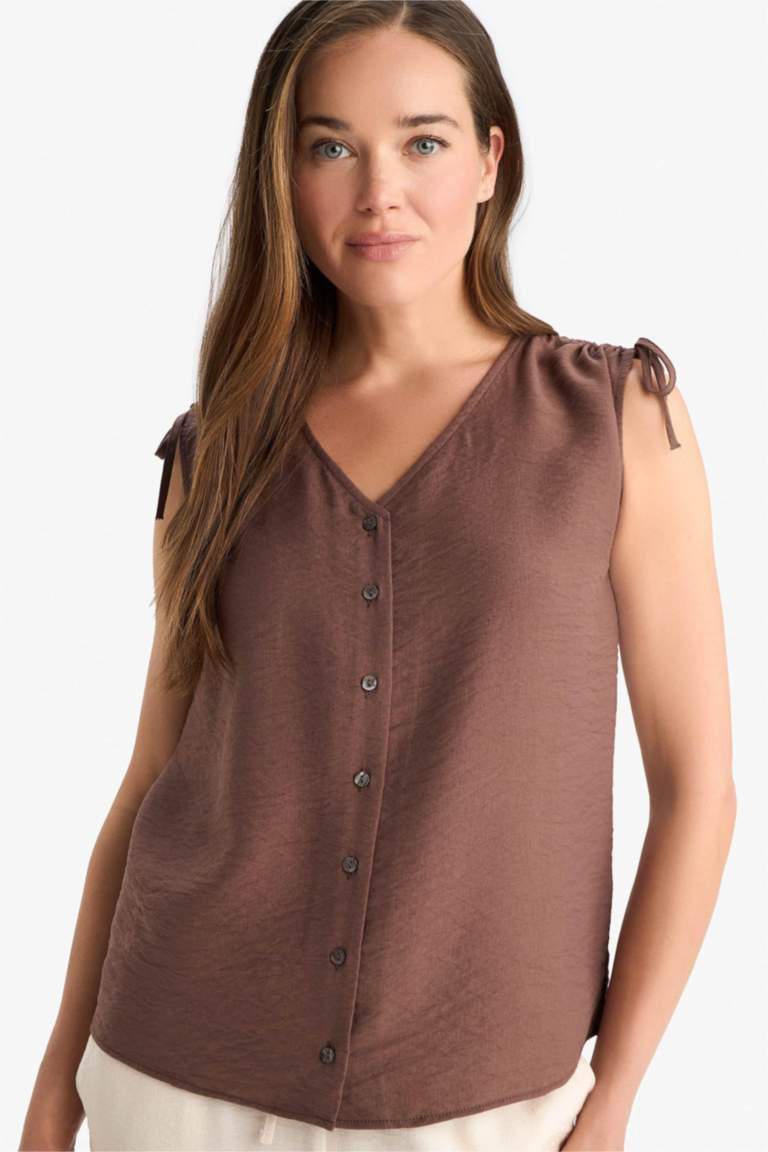 Blouse froncée sans manches à col en V