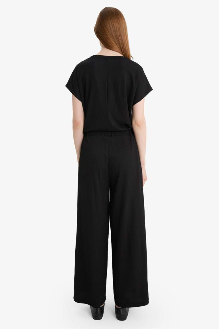 Pantalon droit en tissu froissé à taille élastique