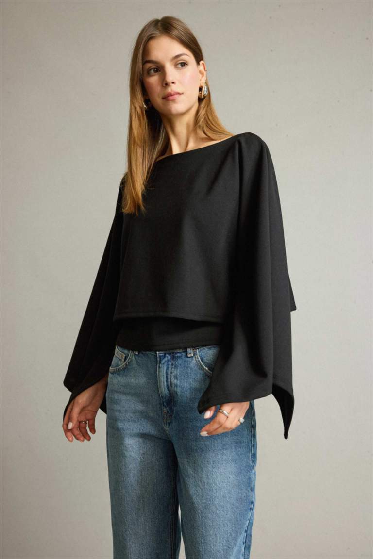 بلوزة ردن عريض وياخة عريضة