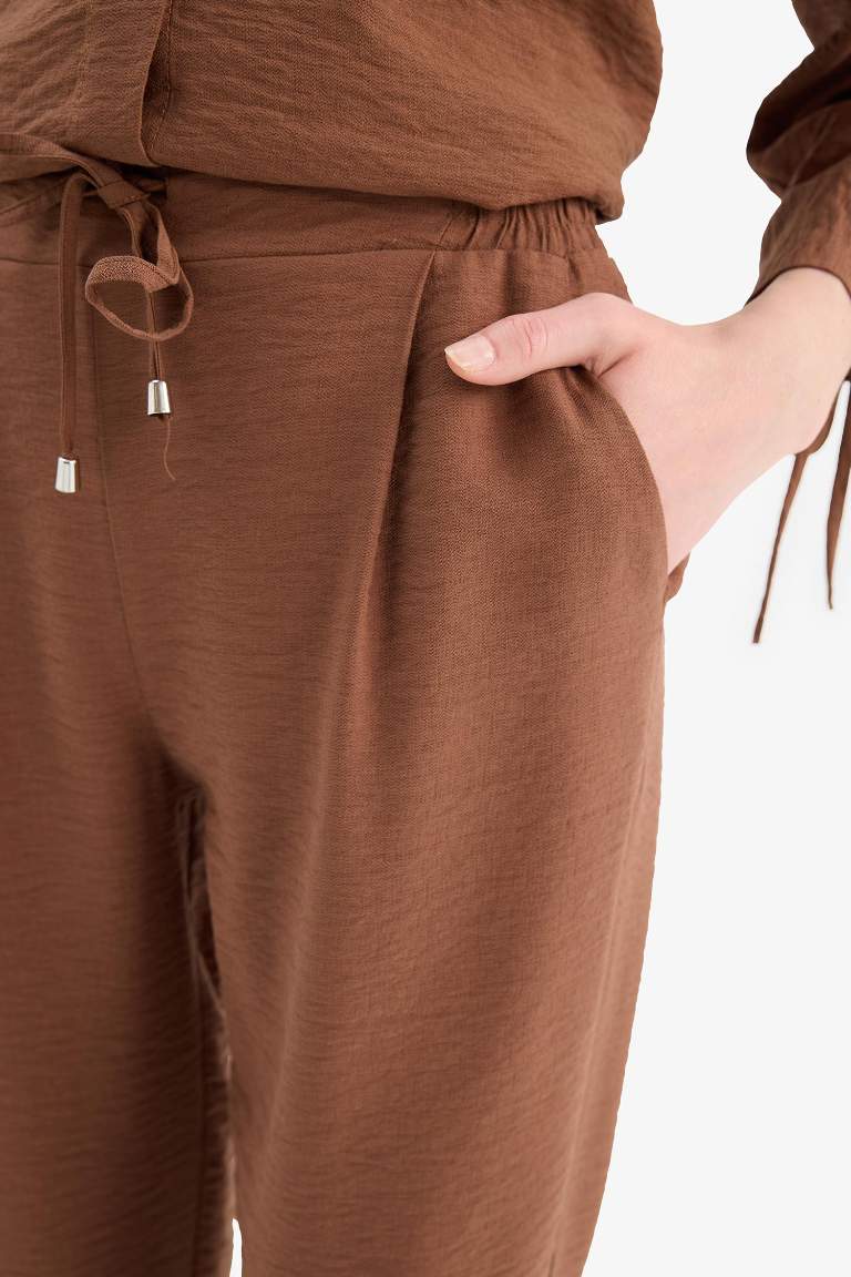 Pantalon en lin droit à taille haute avec poches