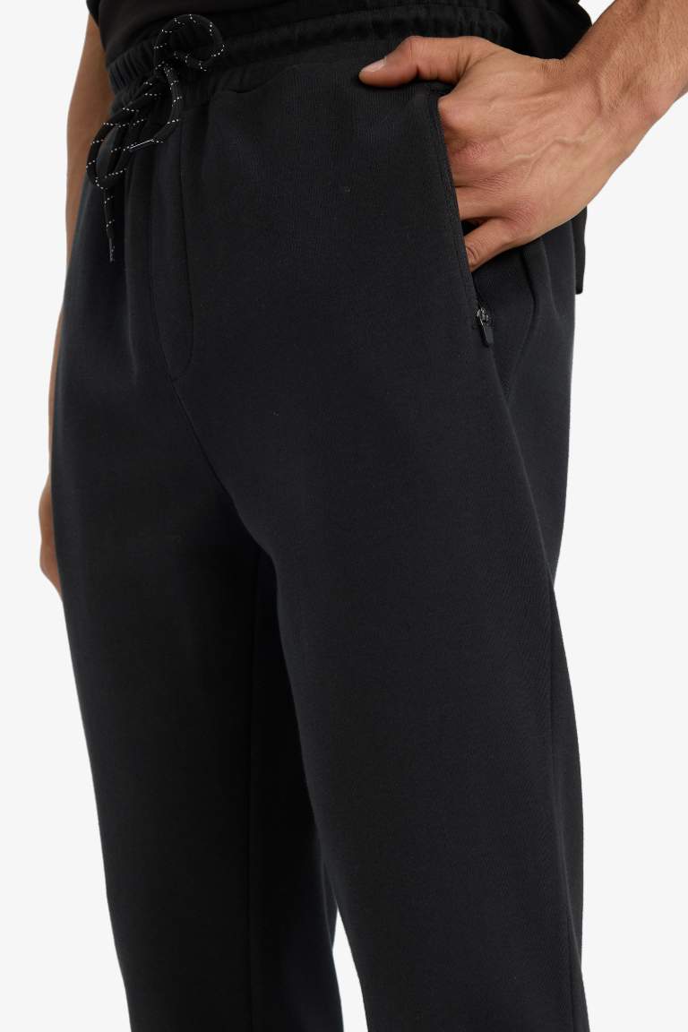 DeFactoFit Slim Fit Dar Kesim Fermuarlı Standart Paça Jogger Eşofman Altı