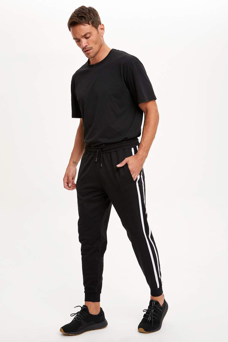 Noir HOMME Pantalon de jogging slim à rayures 1517957 ...