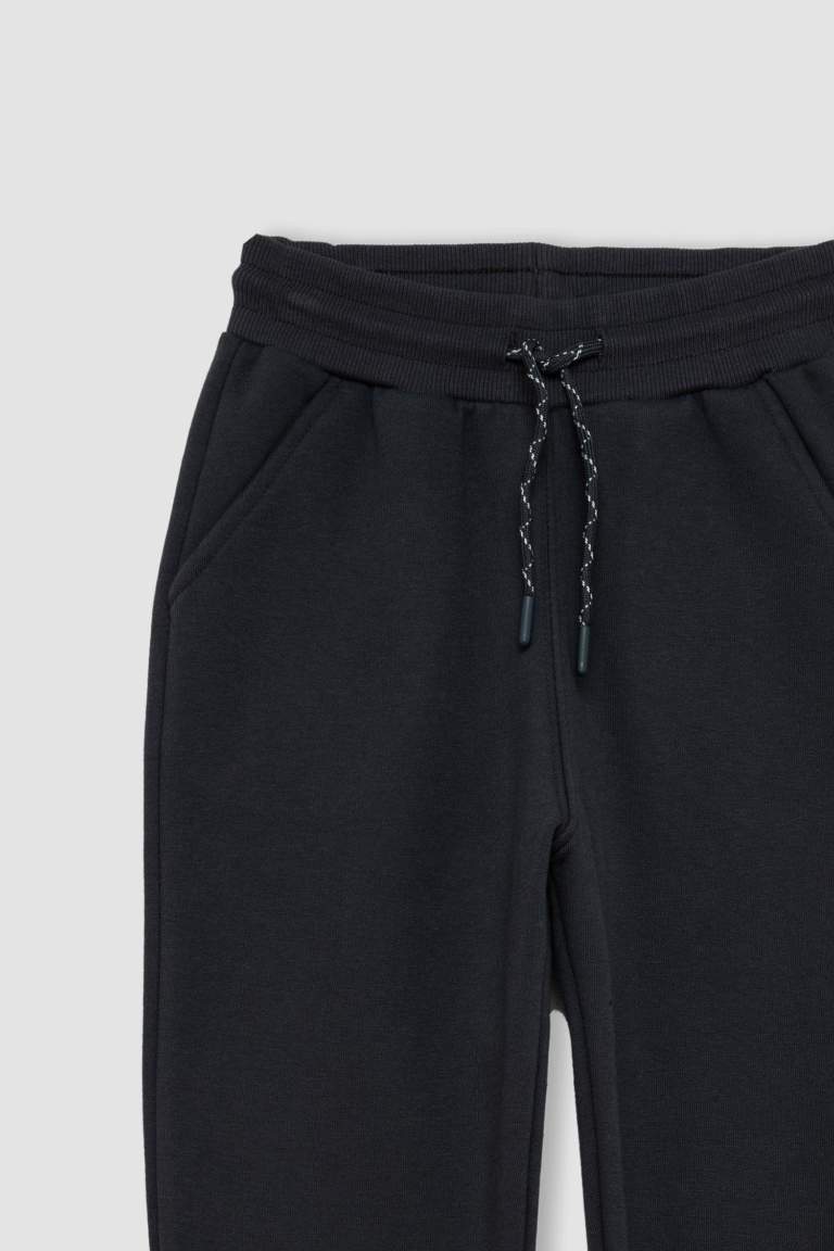 Pantalon de Jogging avec taille et chevilles élastiques et avec poches pour Garçon