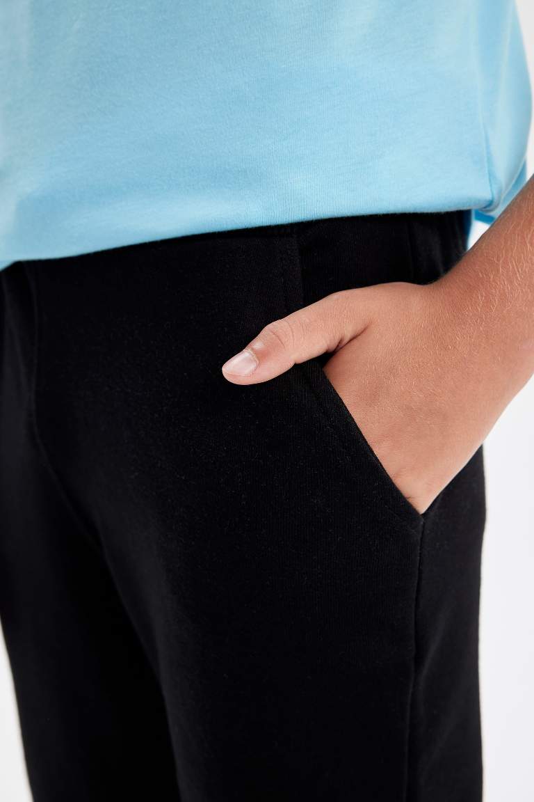 Pantalon de survêtement noir à taille élastique et jambes droites pour garçons