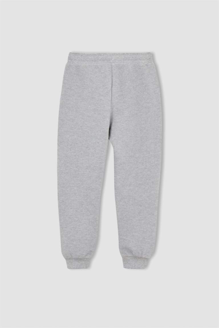 Tricot Comme des Garçons: Manteau gris en peau retournée synthétique à Tricot Comme des Garçons: Manteau gris en peau retournée synthétique à