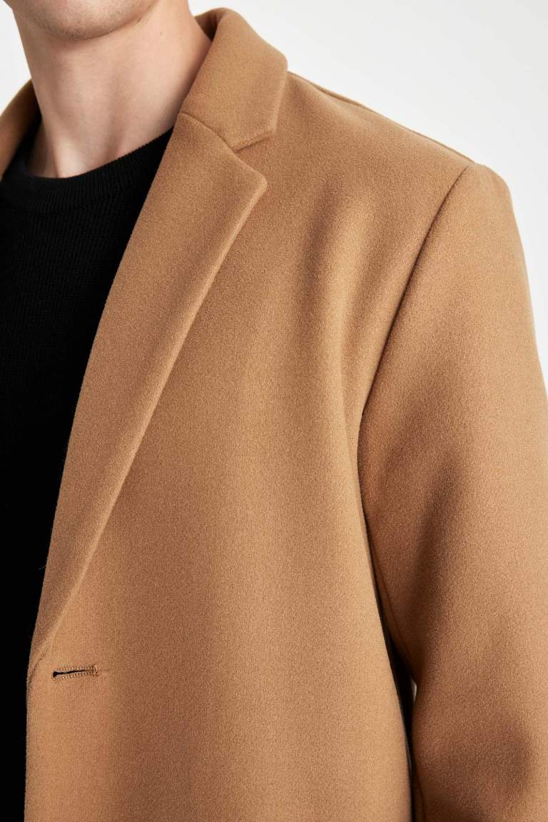 Manteau marron pour homme à coupe relax avec col de blazer à boutons et poches