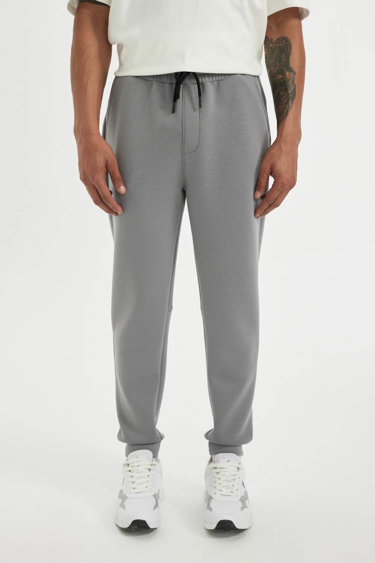 DeFactoFit Slim Fit Sporcu İnce Jogger Eşofman Altı Dar Kesim Skuba Dalgıç Kumaş Standart Paça Beli Bağcıklı Lastikli Paça