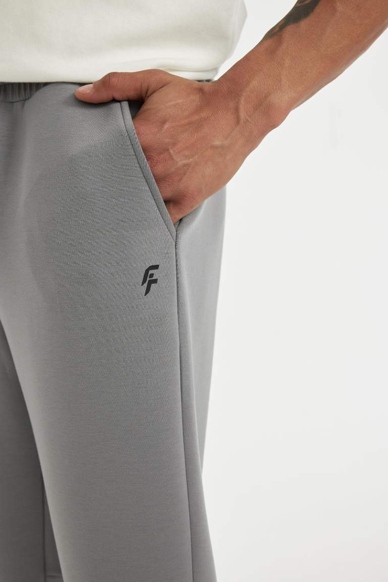 DeFactoFit Slim Fit Sporcu İnce Jogger Eşofman Altı Dar Kesim Skuba Dalgıç Kumaş Standart Paça Beli Bağcıklı Lastikli Paça