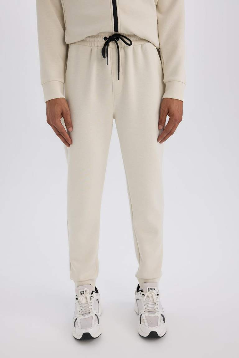 DeFactoFit Slim Fit Sporcu İnce Jogger Eşofman Altı Dar Kesim Skuba Dalgıç Kumaş Standart Paça Beli Bağcıklı Lastikli Paça