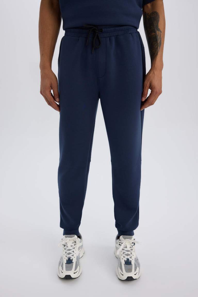 DeFactoFit Slim Fit Sporcu İnce Jogger Eşofman Altı Dar Kesim Skuba Dalgıç Kumaş Standart Paça Beli Bağcıklı Lastikli Paça