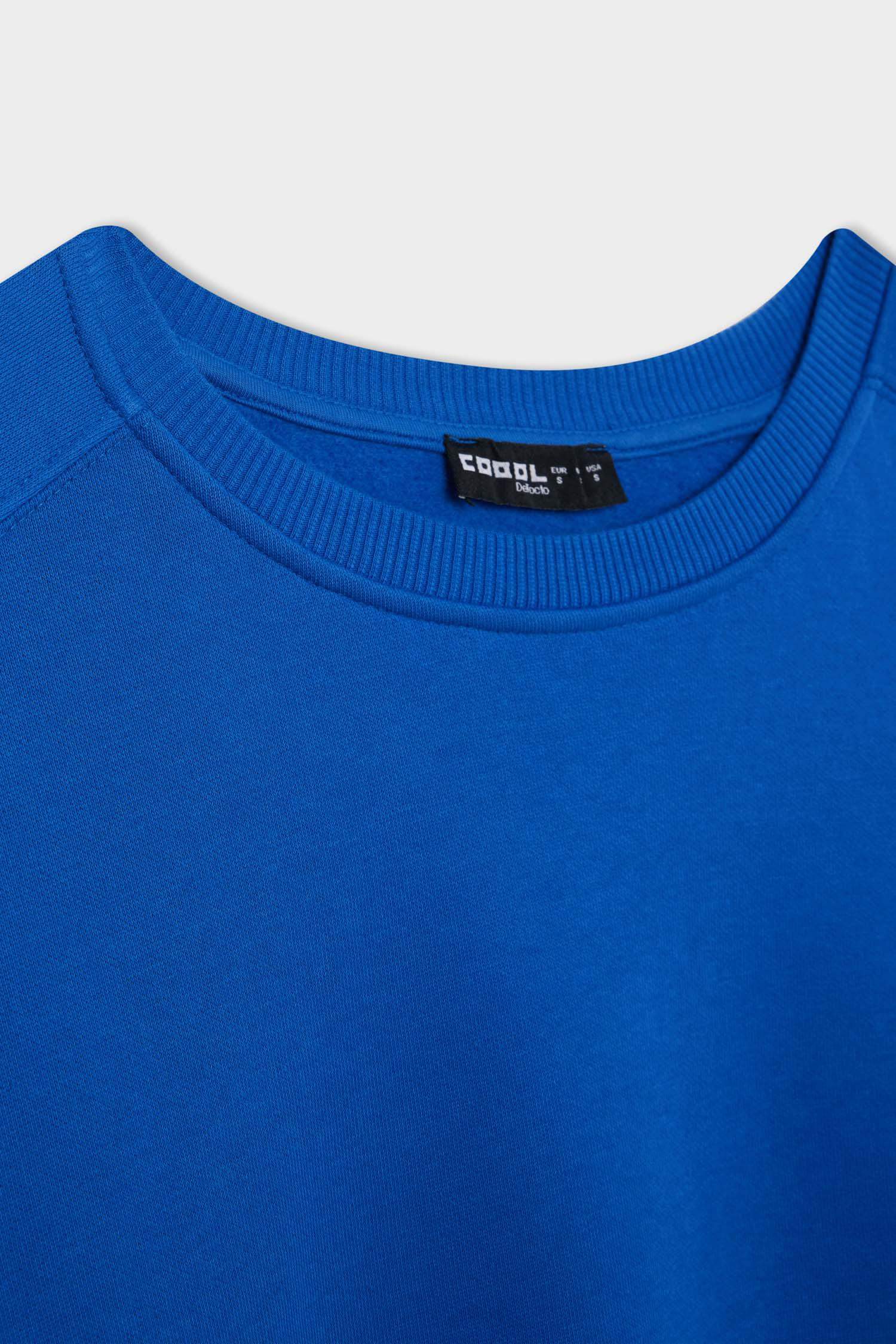 سويت شيرت واسع برقبة مستديرة