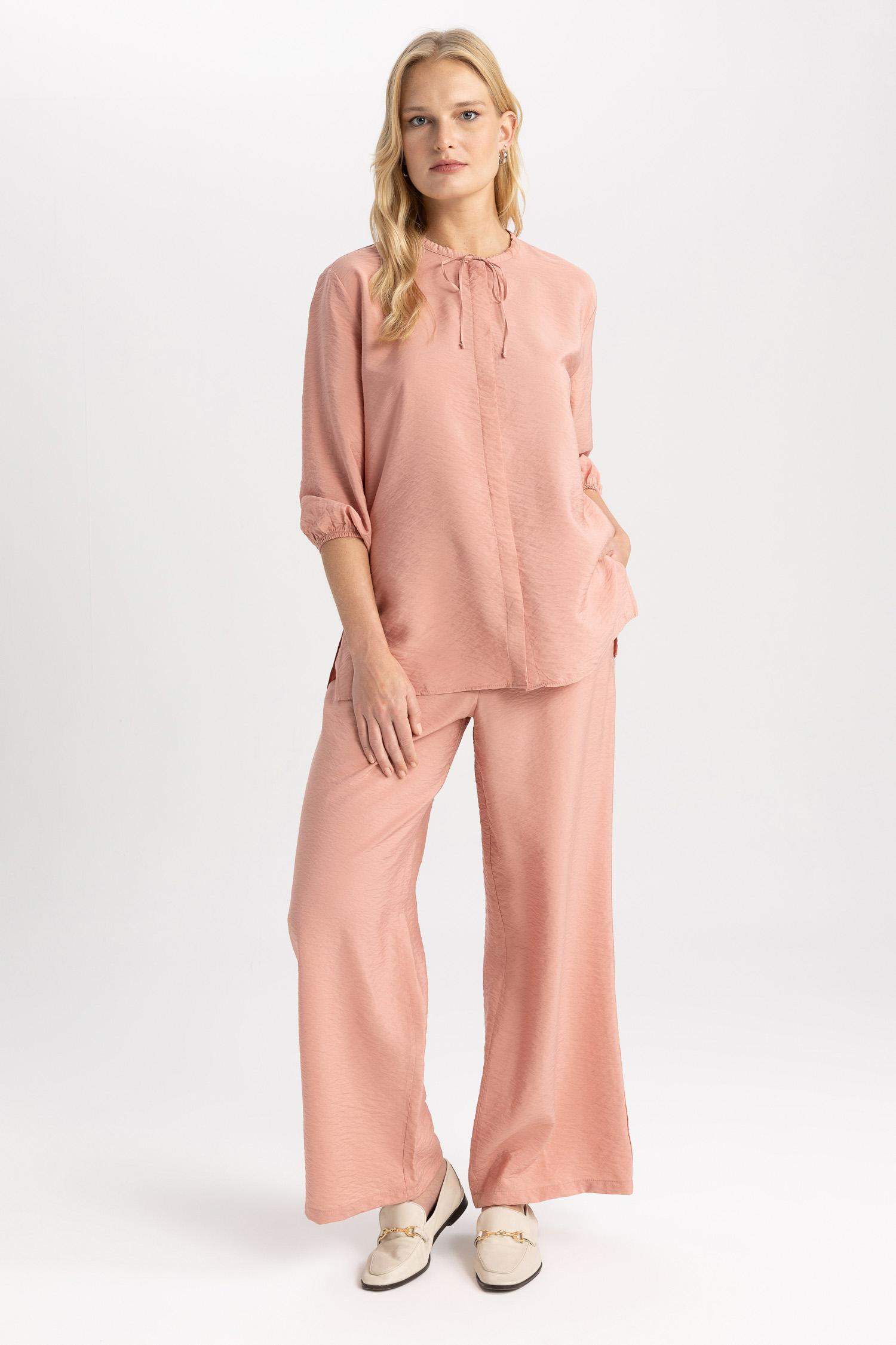 قميص واسع كم طويل برقبة مدورة