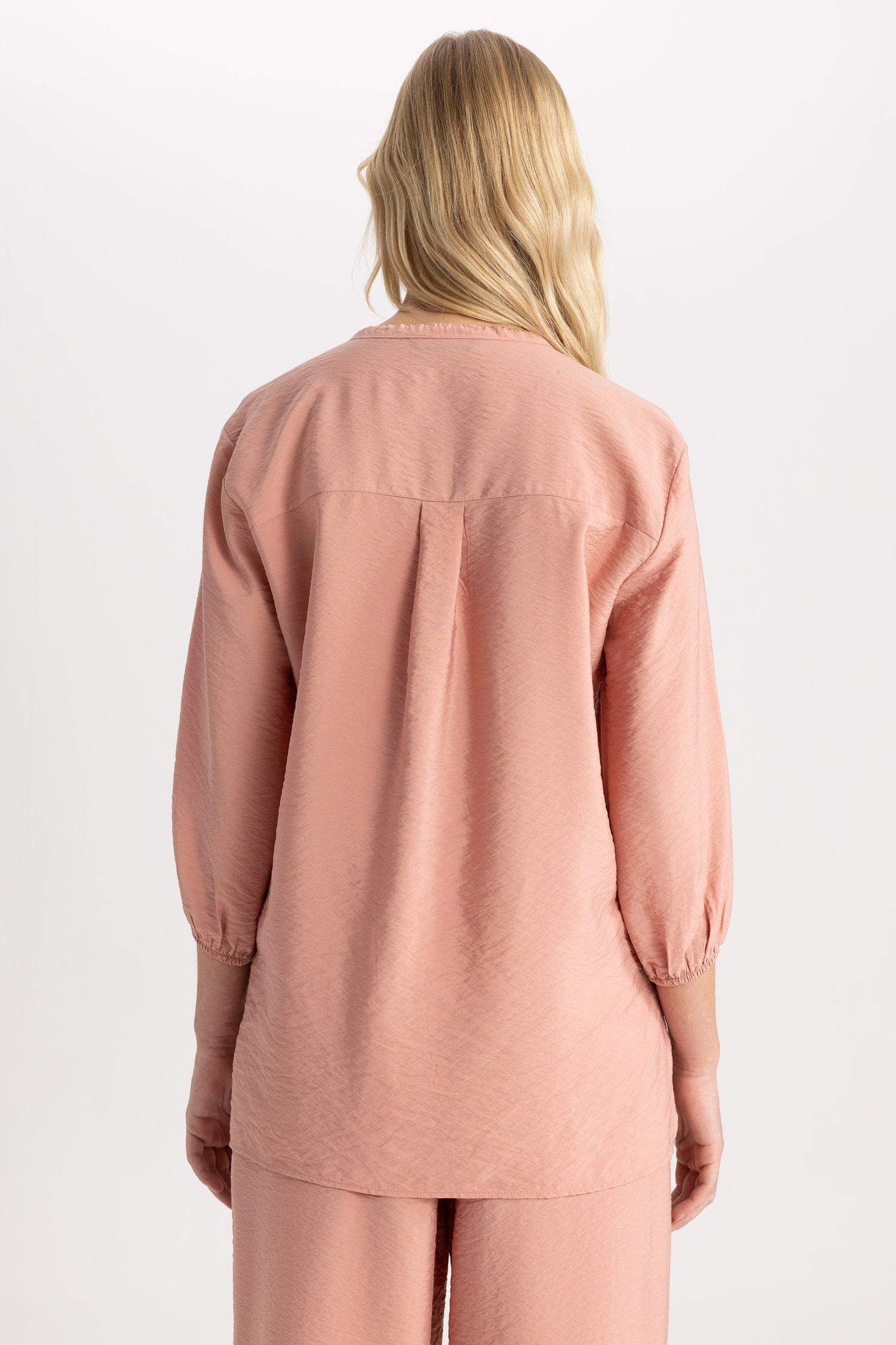 قميص واسع كم طويل برقبة مدورة