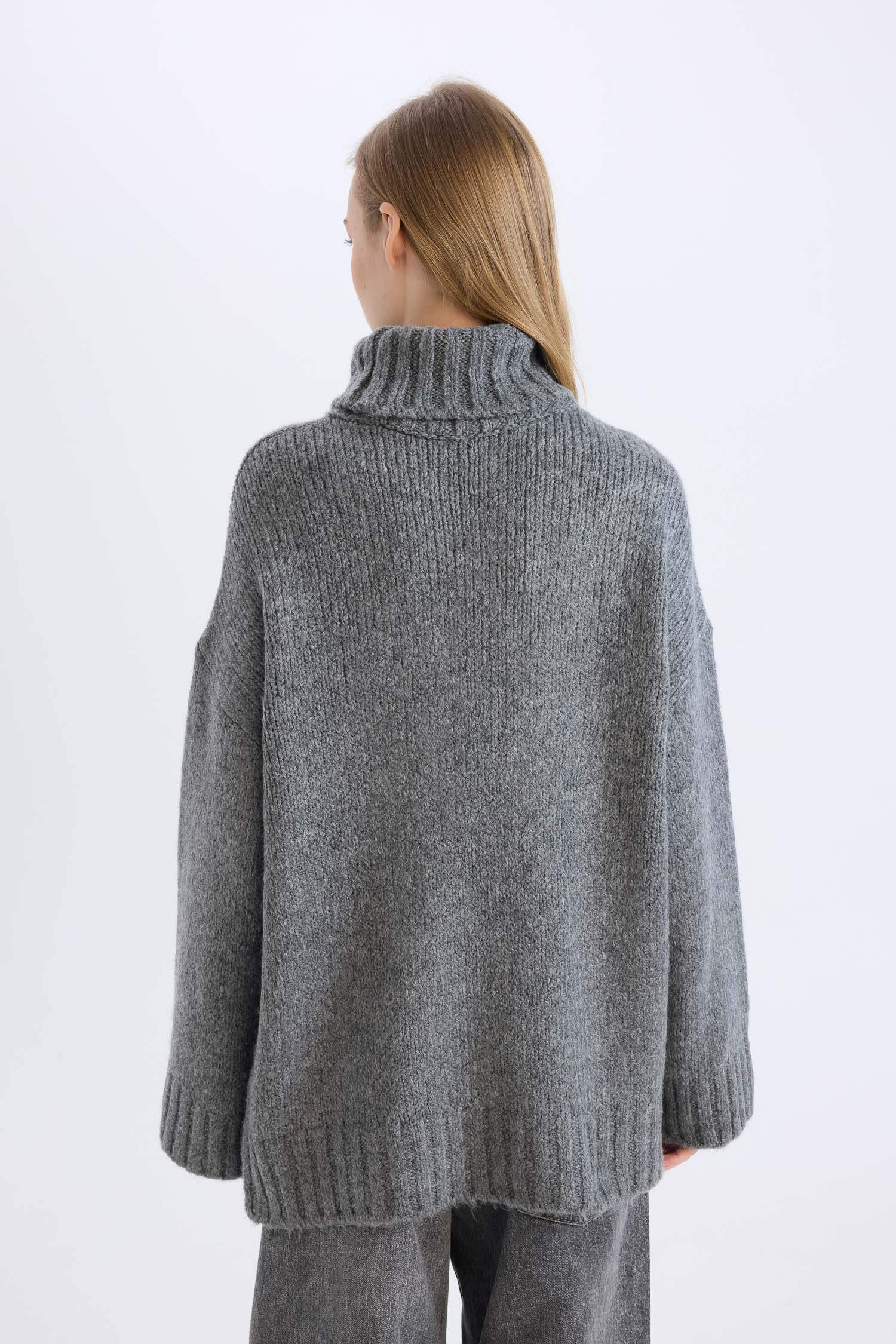 بلوز صوف تريكو سادة اوفر سايز بياخة عالية