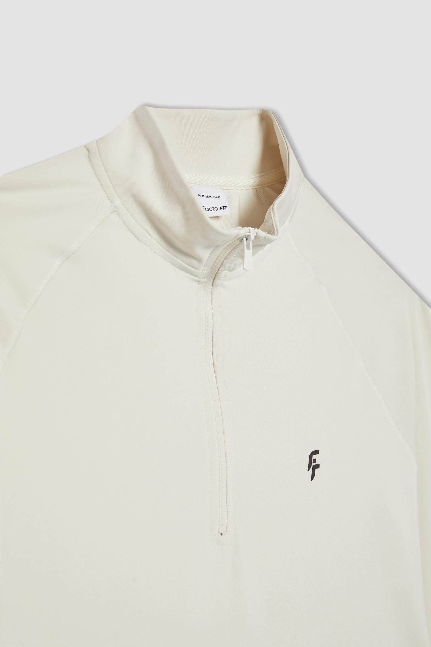 تيشيرت رياضي كم طويل قصة طويلة بطبعة شعار