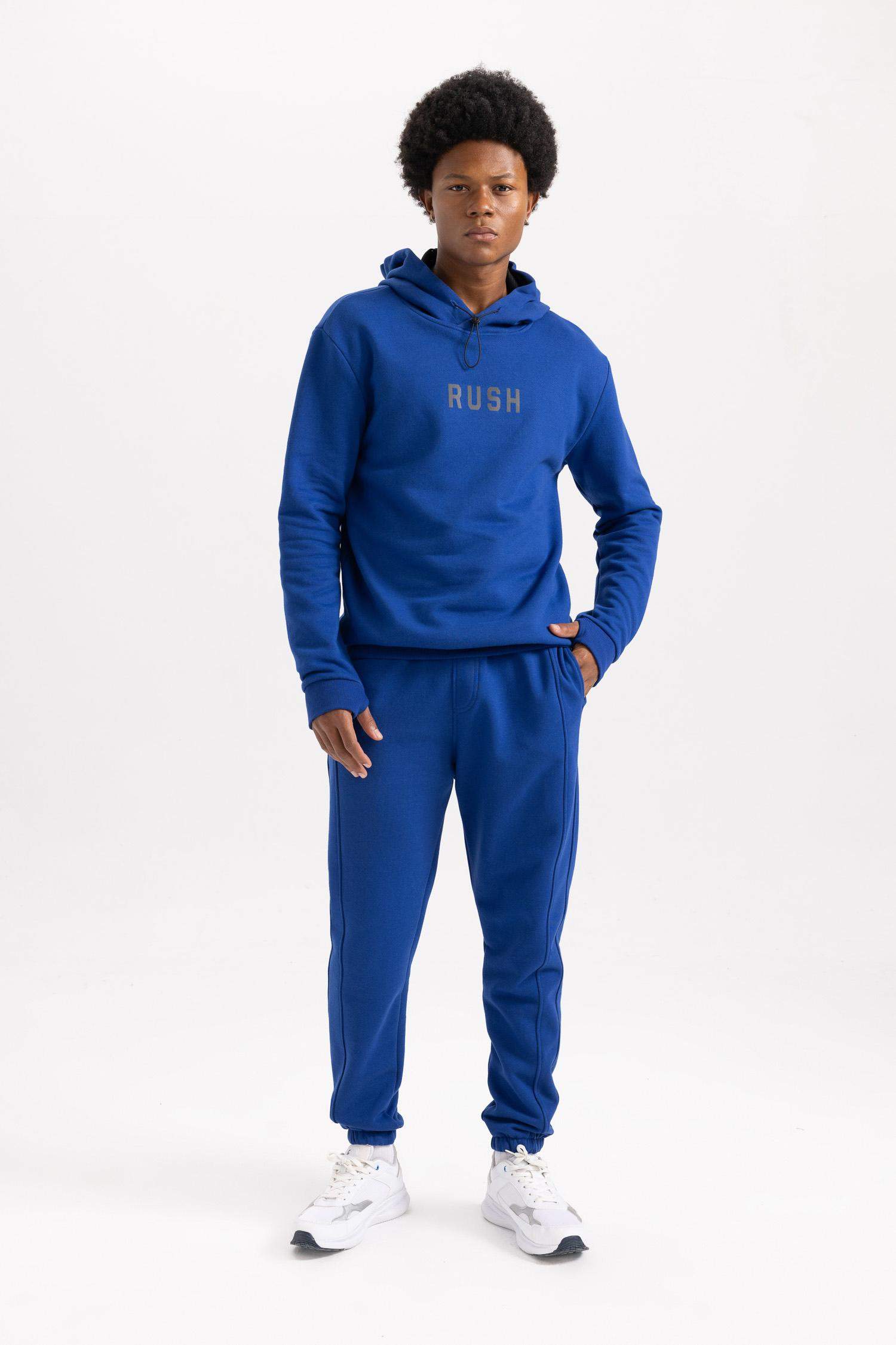 سويت شيرت مطبوع قصة عادية بكابيشون من DeFactoFit