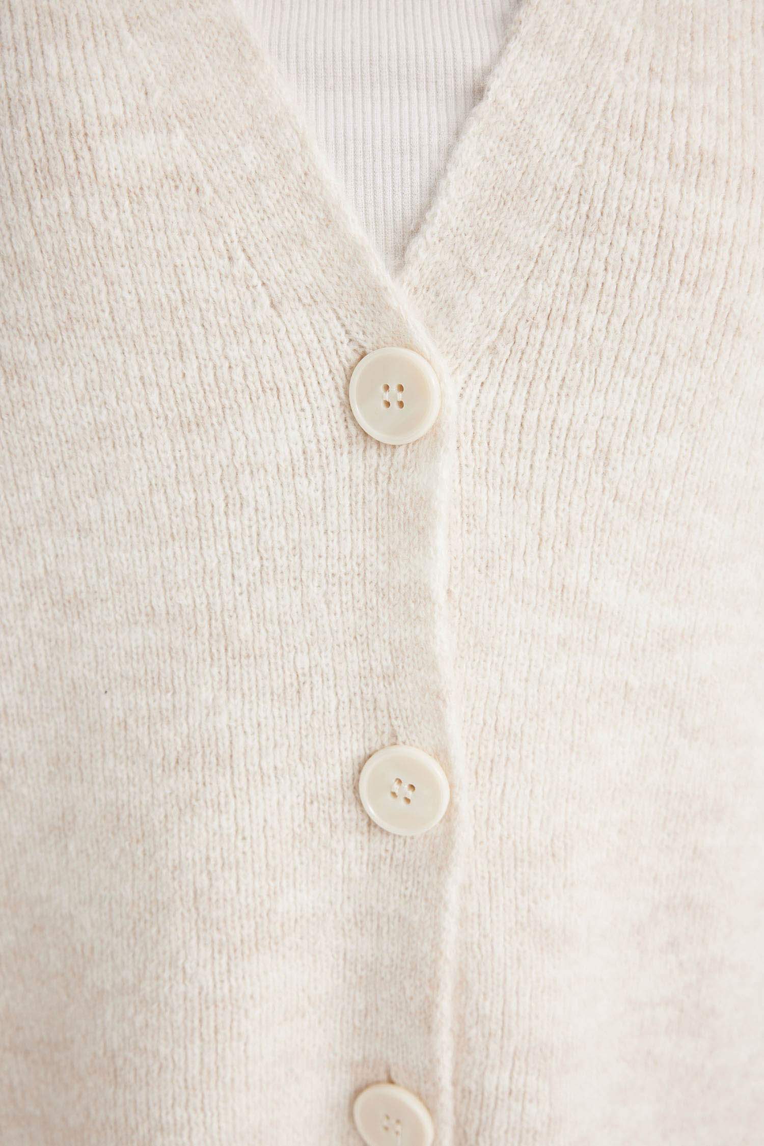 جاكيت صوف اوفر سايز بياخة V