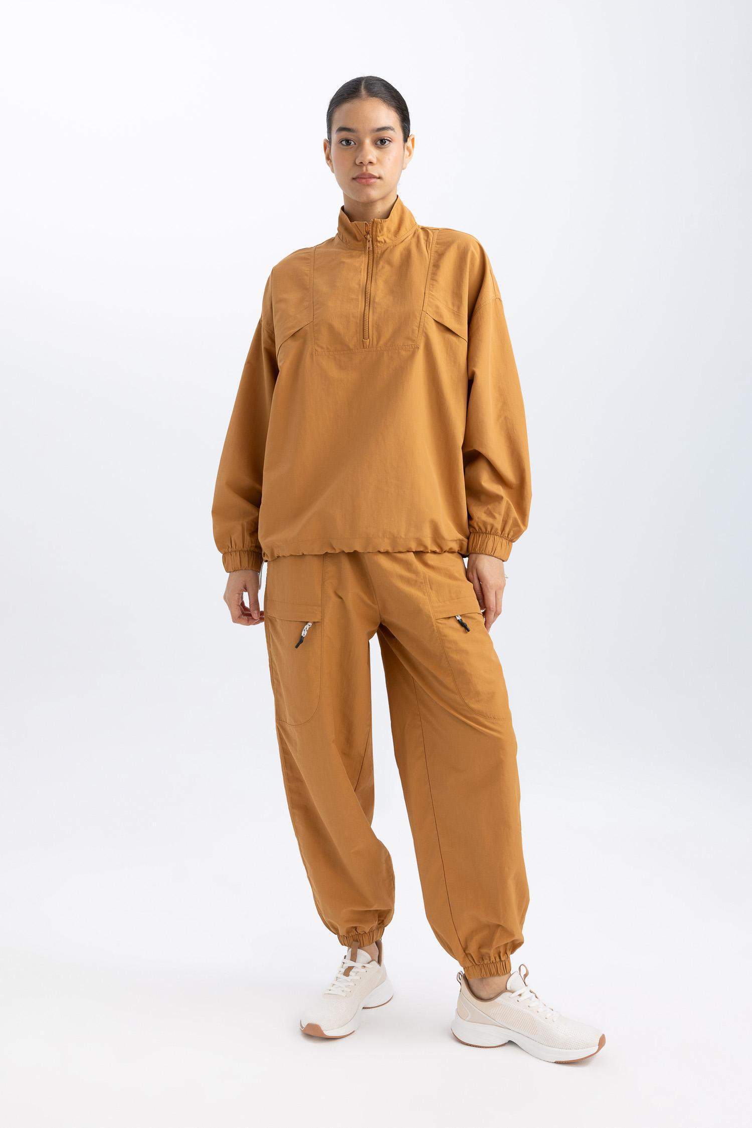 بنطلون بجامة رياضي منسوج قصة فضفاضة بجيب من DeFactoFit