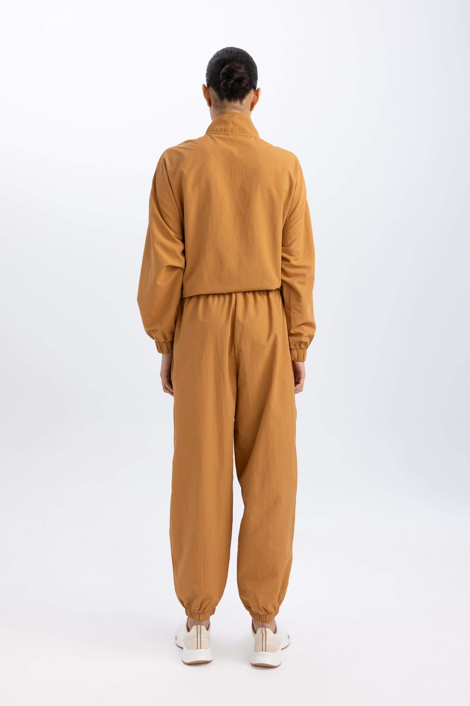 بنطلون بجامة رياضي منسوج قصة فضفاضة بجيب من DeFactoFit