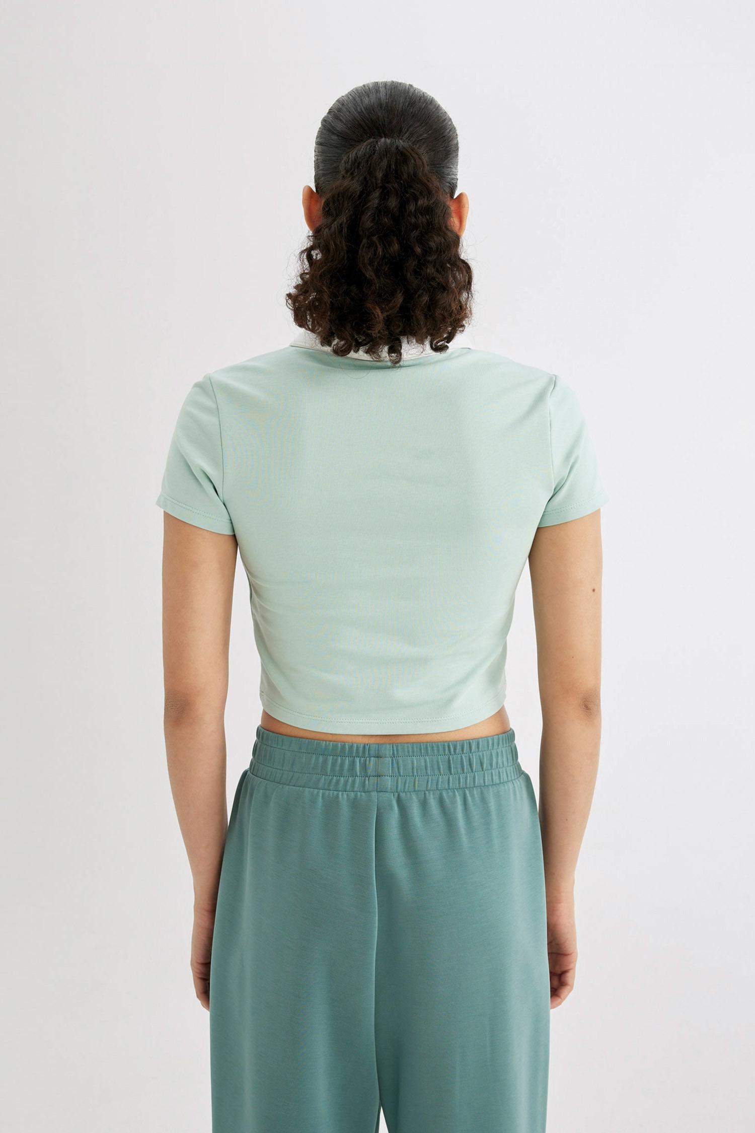 تيشيرت رياضي نص ردن قصة عادية بياخة بولو من DeFactoFit