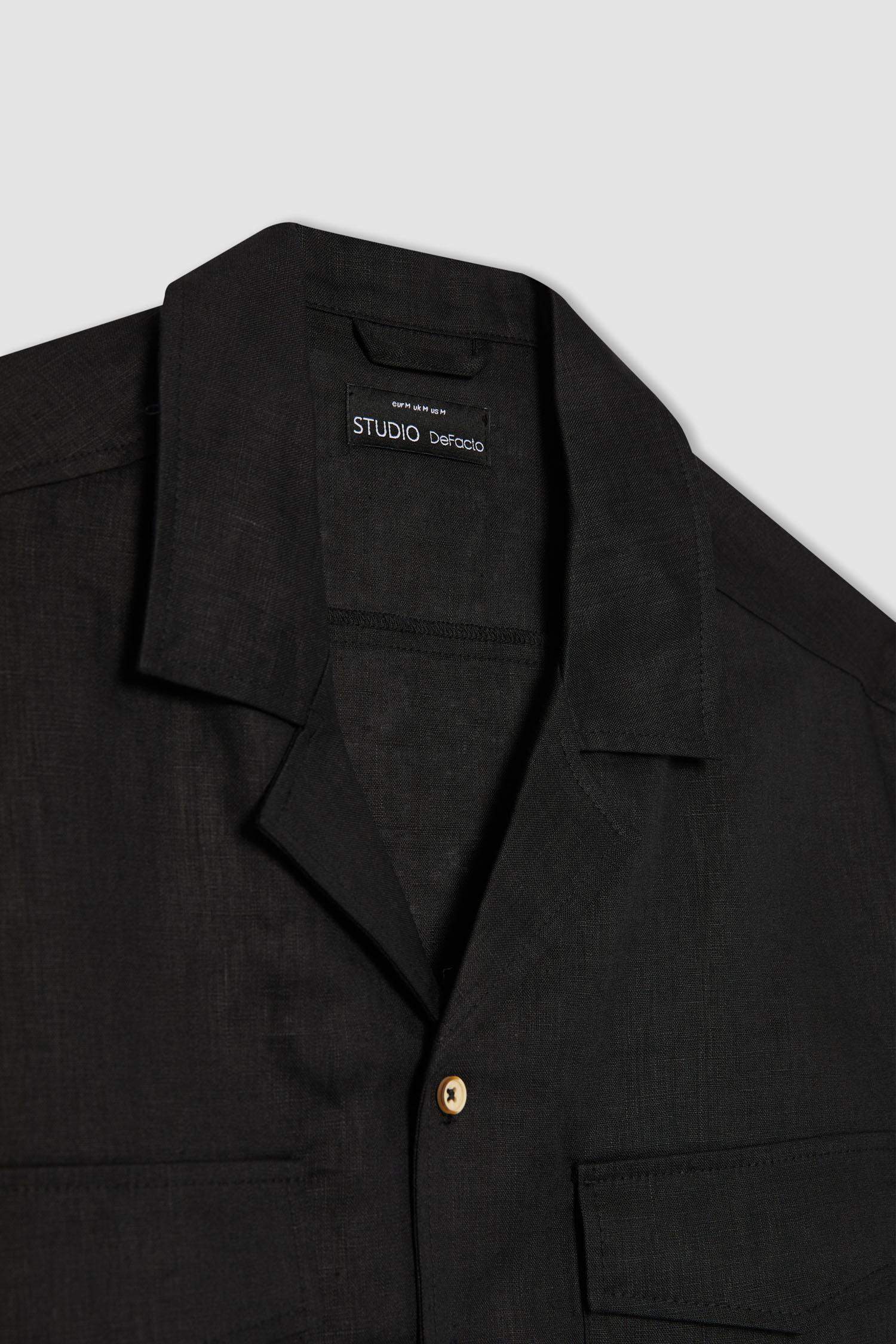 قميص بولو اسود كتان نص كم قصة مريحة