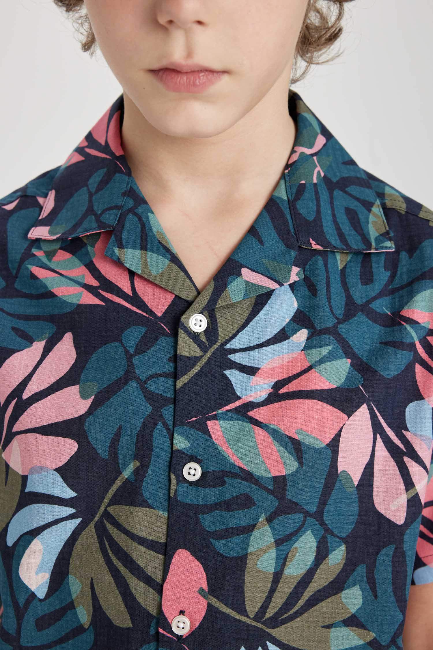 قميص بولو اولادي نص كم ذو مظهر كتاني اوفر سايز