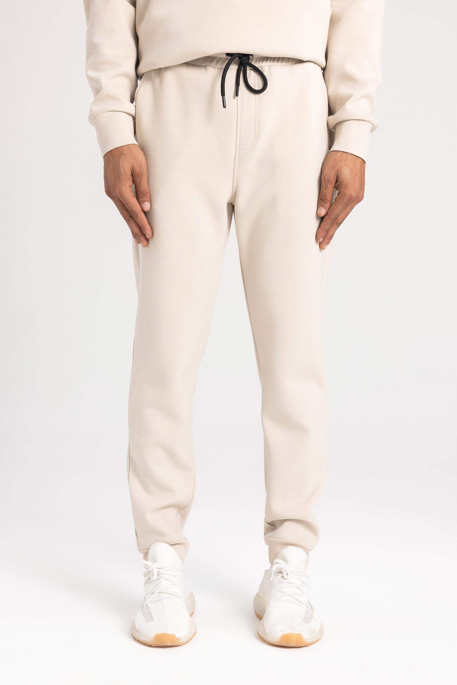 بنطلون بجامة رياضي قماش سكوبا سليم فيت برجل مطاطي