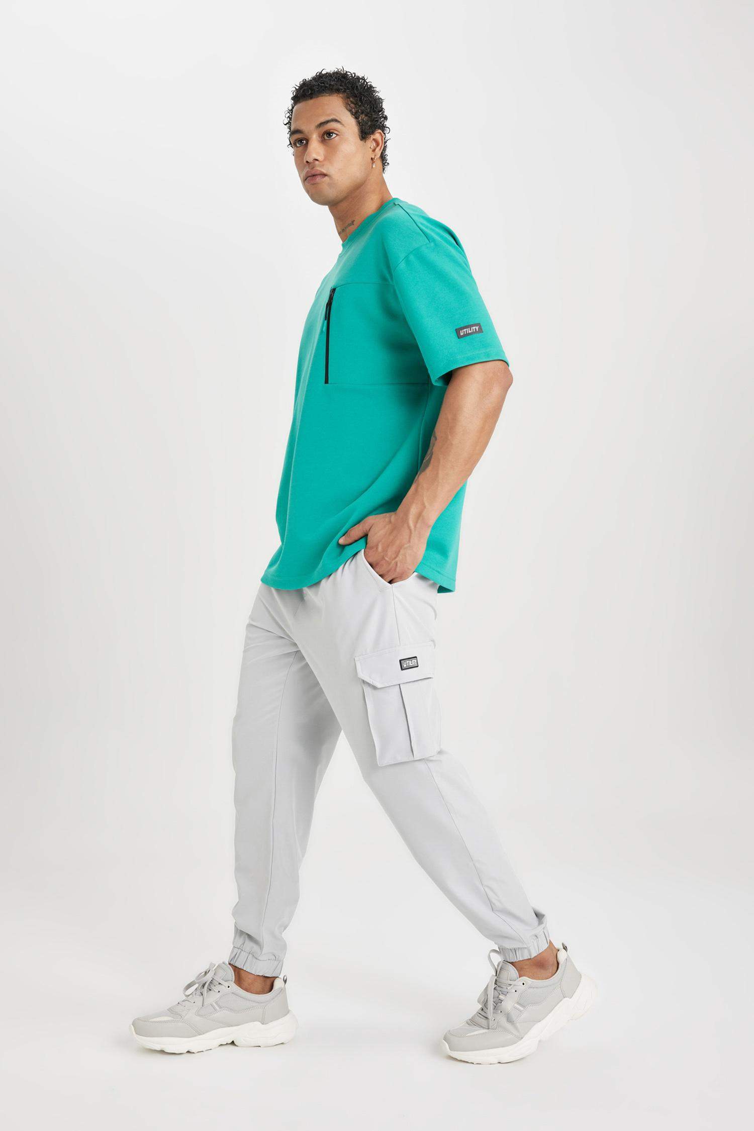 DeFactoFit Sporcu Jogger Eşofman Altı Standart Fit Kargo Cepli Dokuma Beli Paçası Lastikli