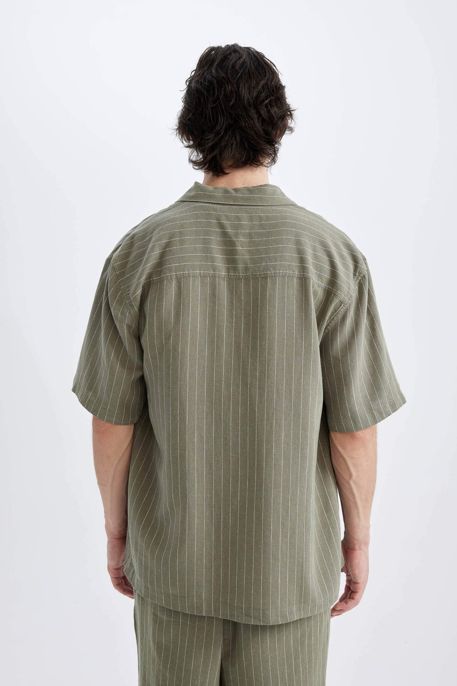 قميص بولو كتان مخطط قصة مريحة