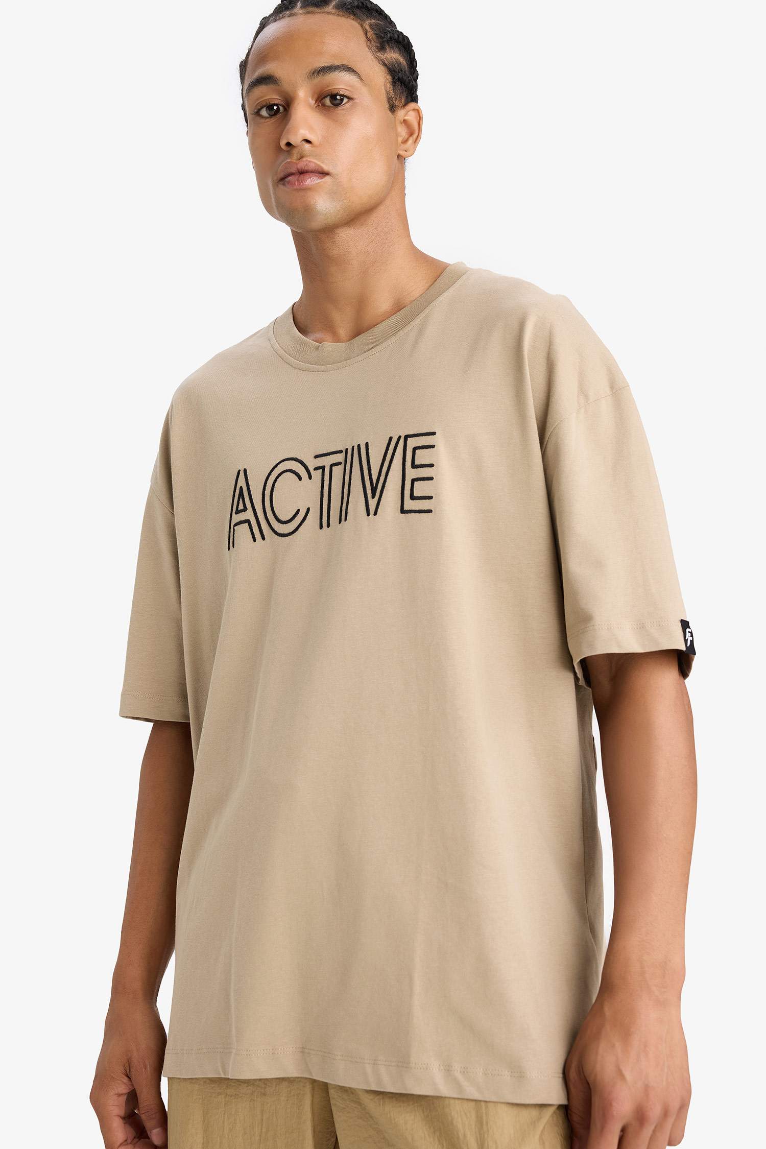 تي شيرت اوفر سايز مطرز بياخة مستديرة من DeFactoFit