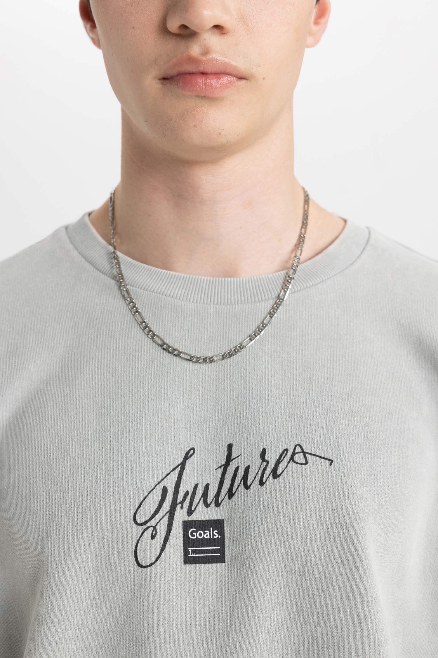 سويت شيرت بطبعة شعار قصة مريحة بياخة مستديرة