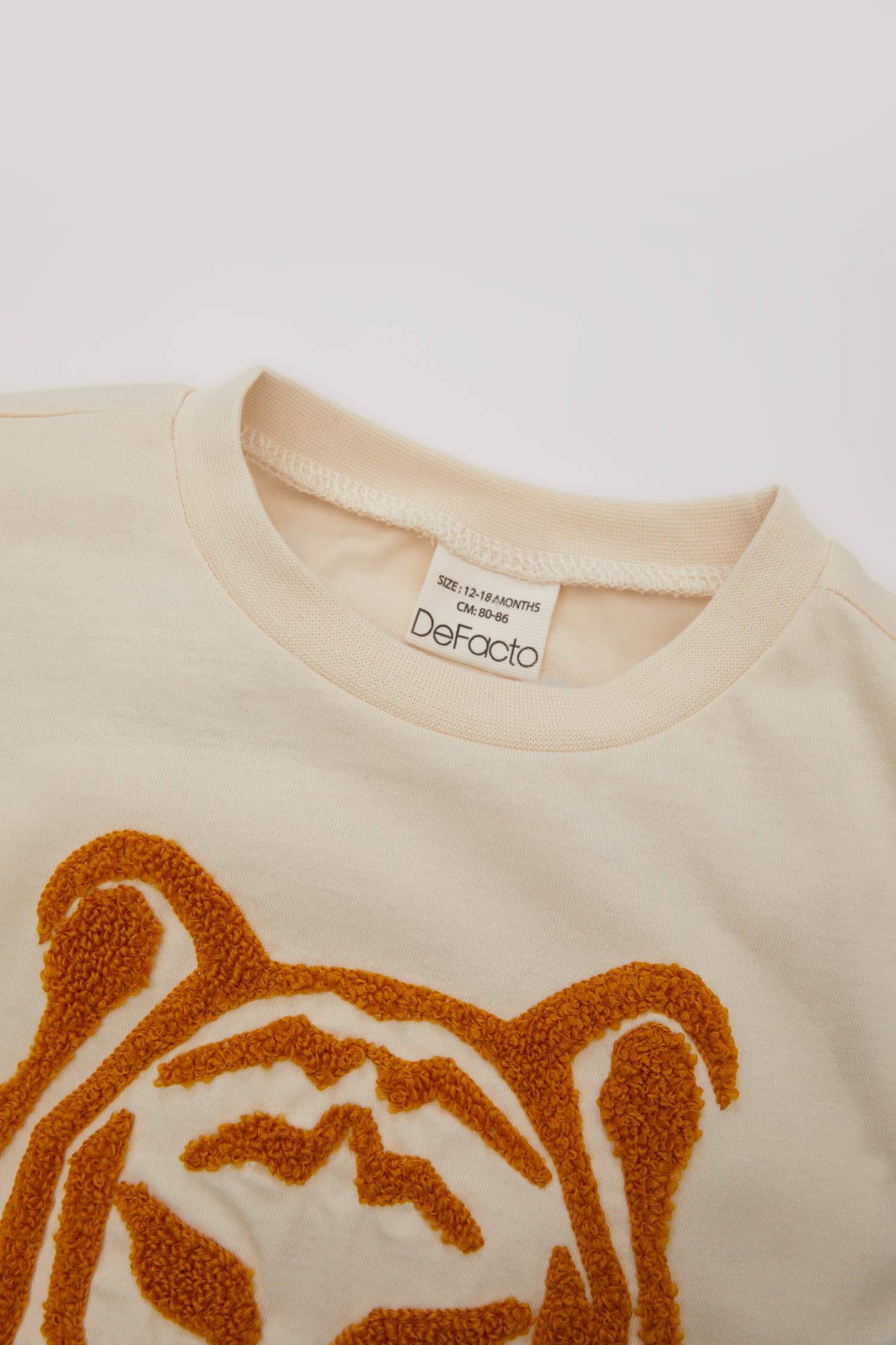 تيشيرت بيبي اولادي نص كم قصة عادية بياقة مستديرة بطبعة نمر