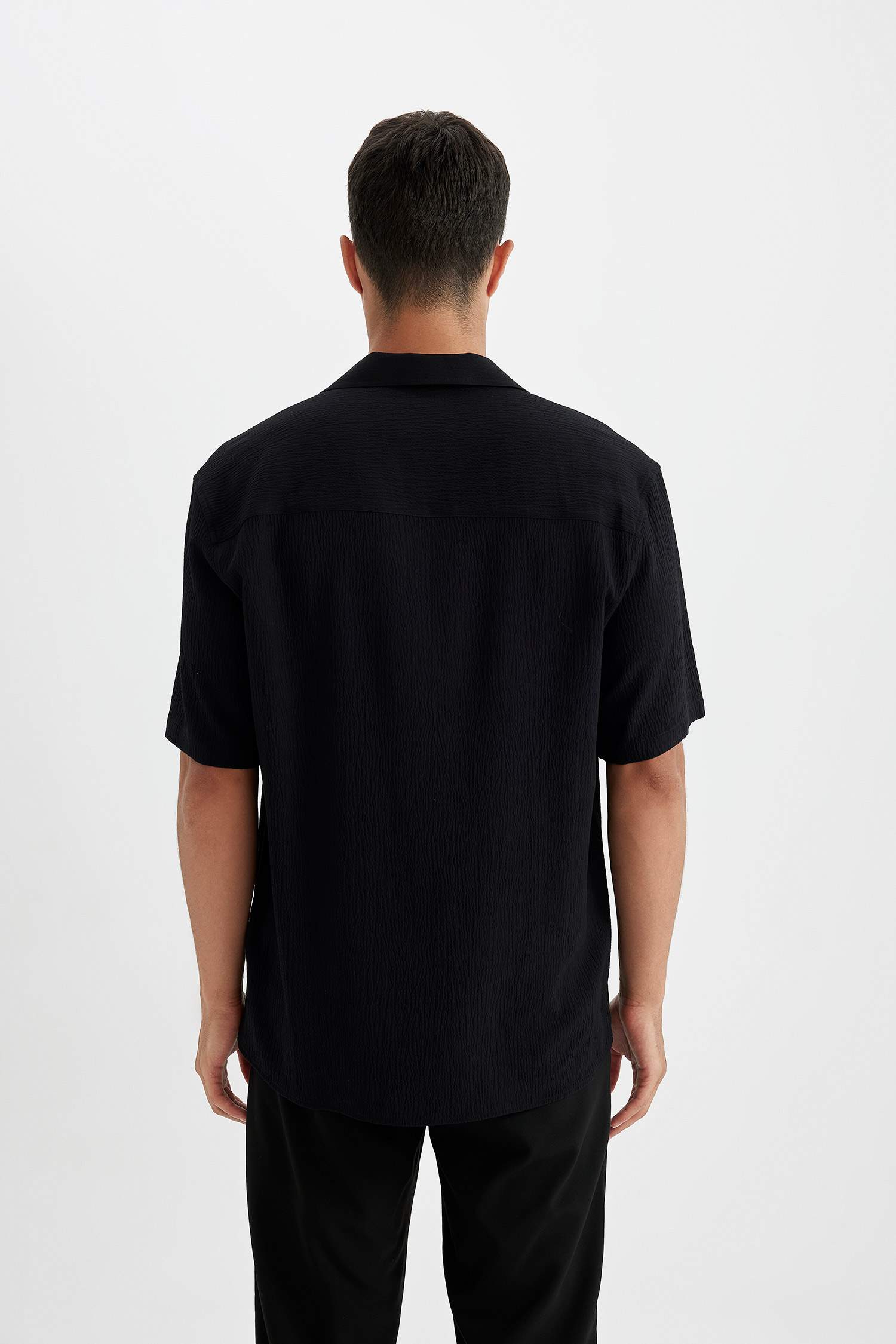 قميص بولو نص كم محبوك قصة مريحة