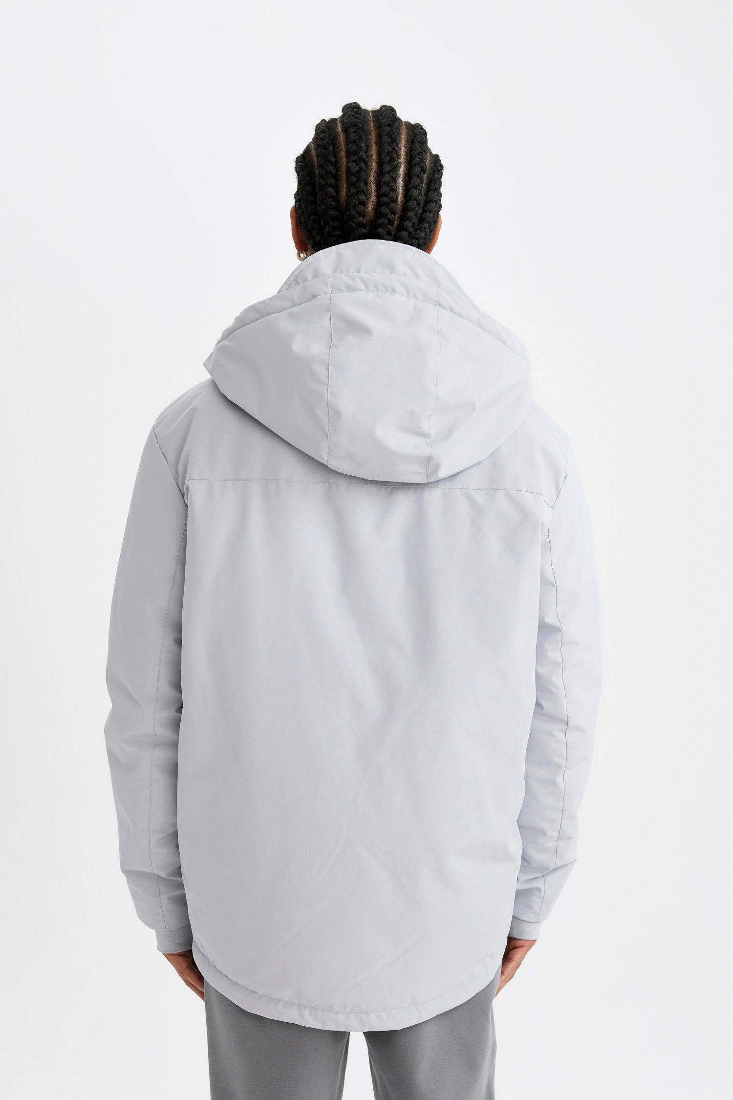 جاكيت قصة عادية بغطاء للرأس مقاوم للماء بسحاب من DeFactoFit