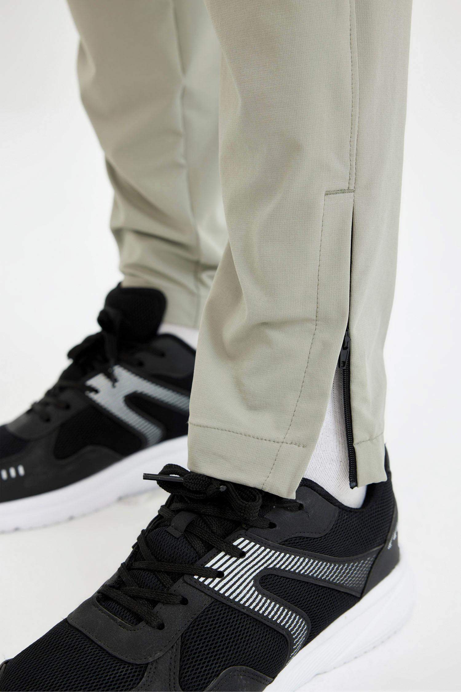 بنطرون منسوج سليم فيت برجل بسحاب بجيب من DeFactoFit