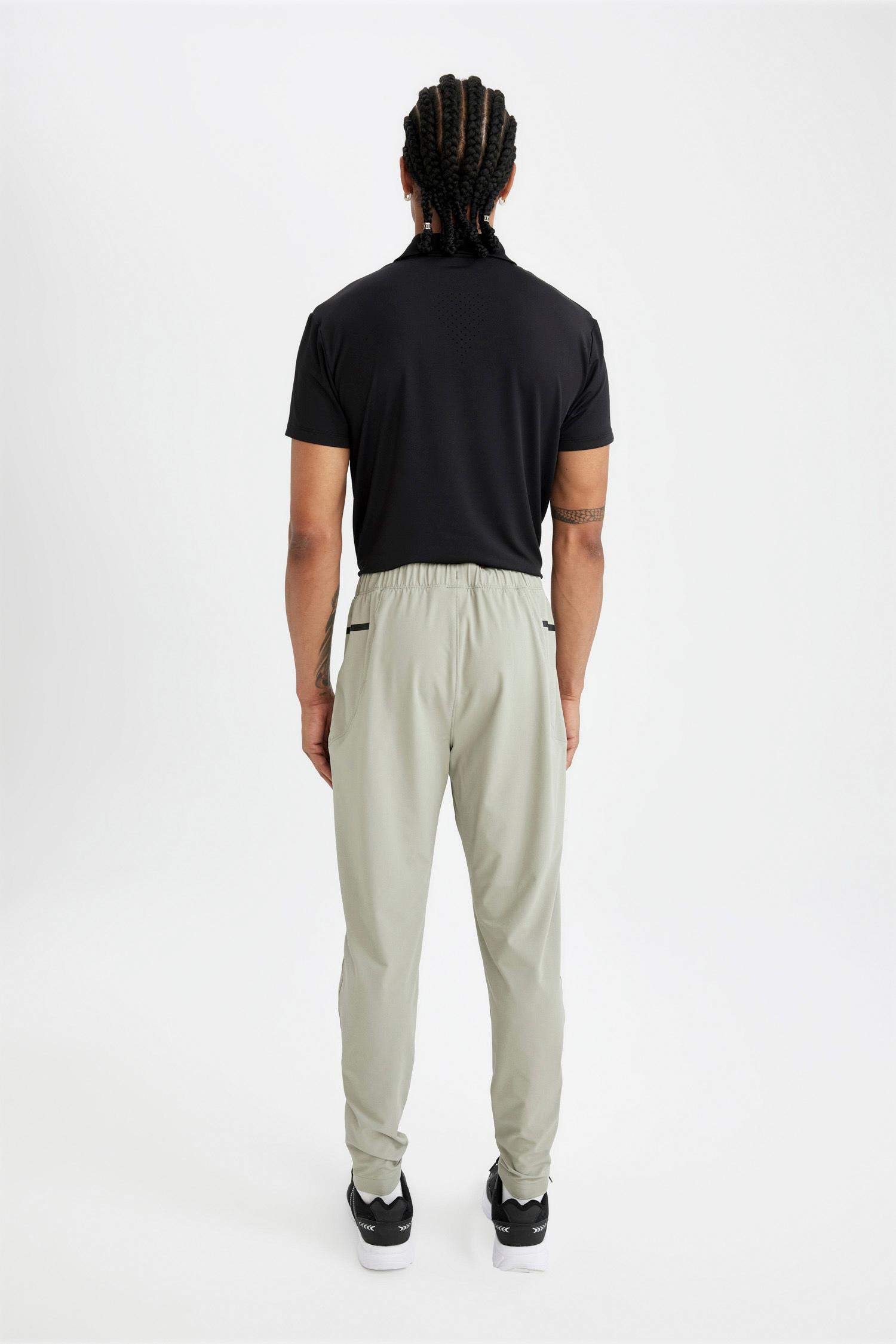 بنطرون منسوج سليم فيت برجل بسحاب بجيب من DeFactoFit