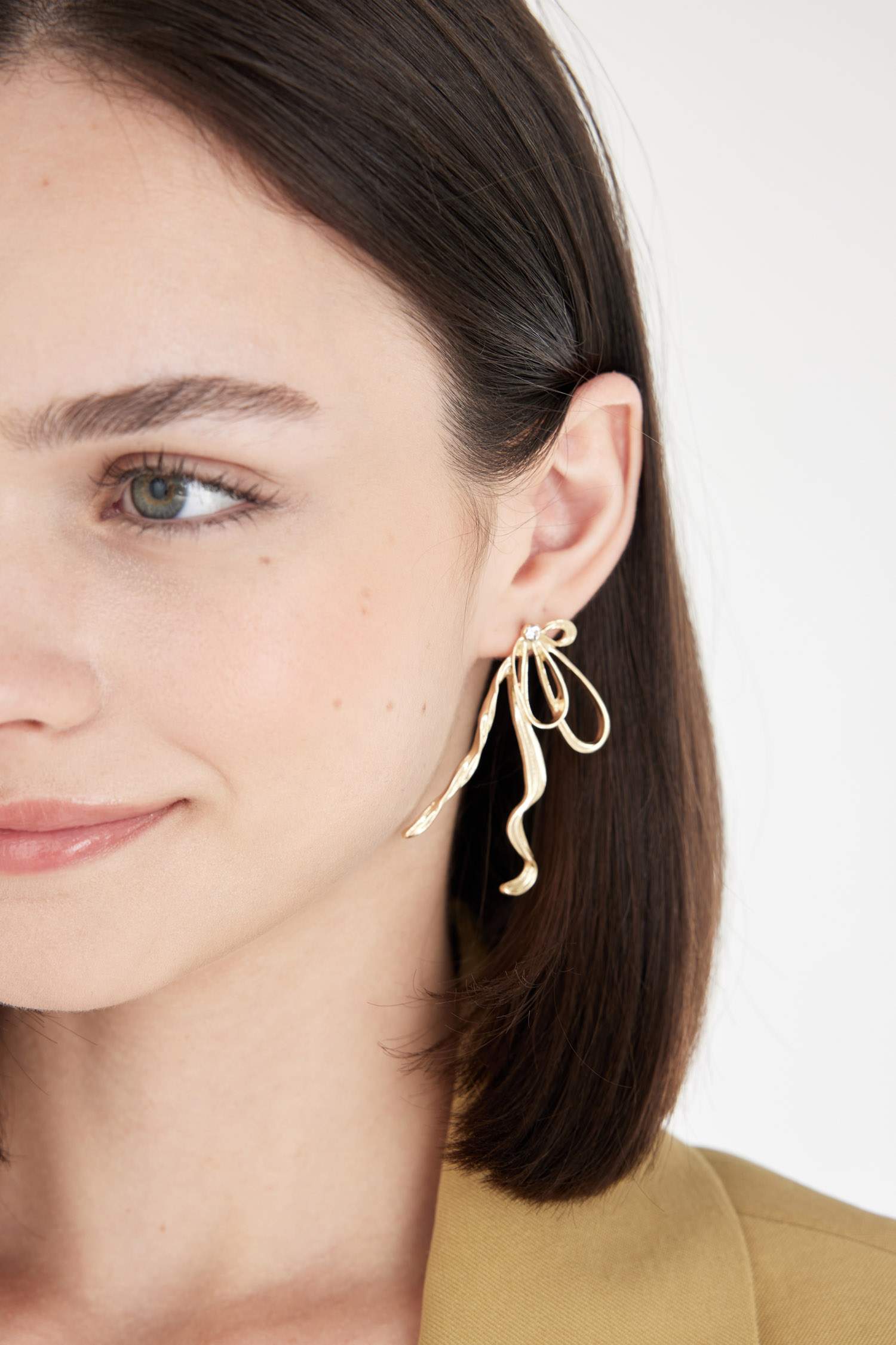 Boucles d'oreilles nœud doré pour femme