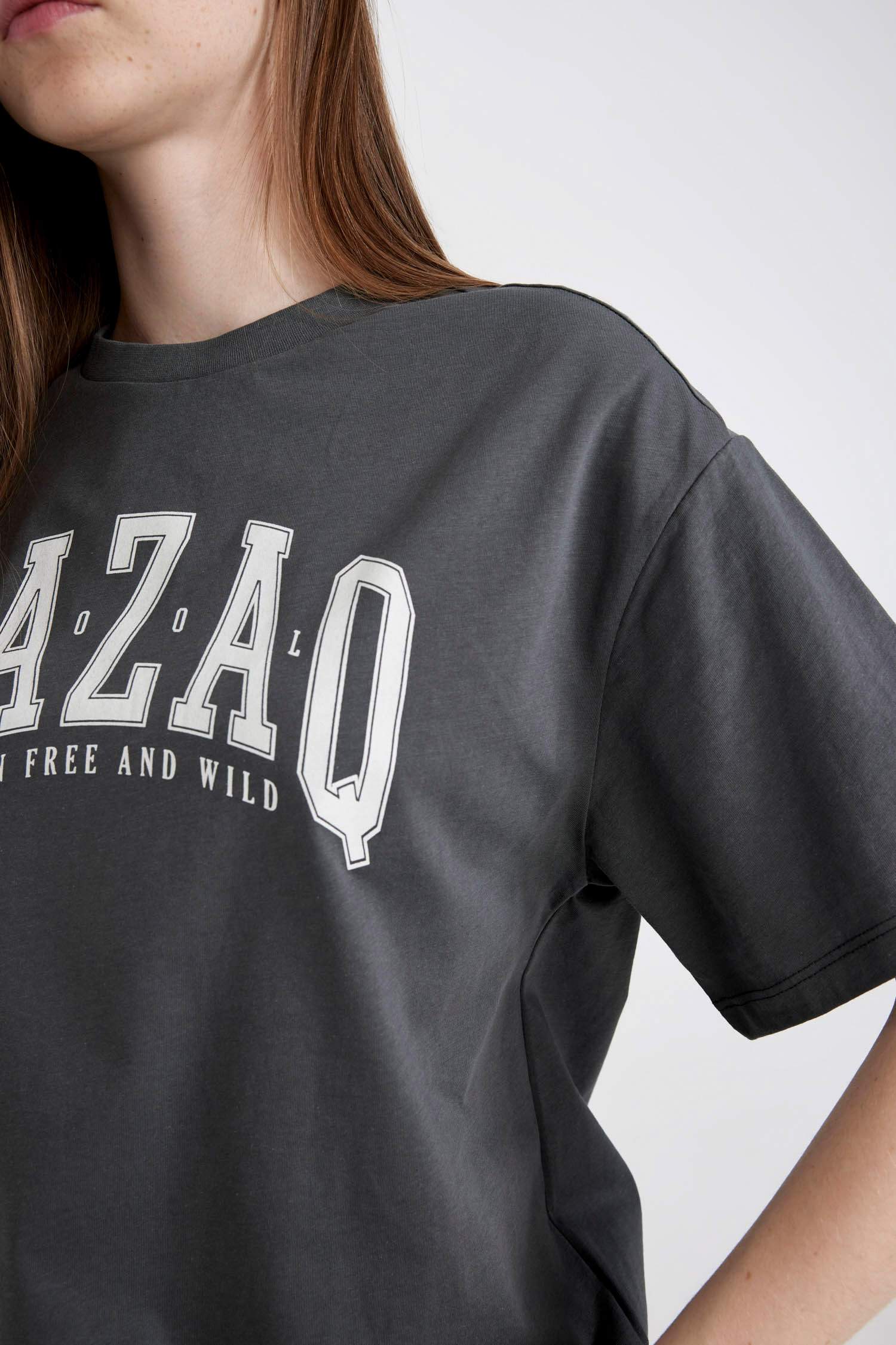 تيشيرت نص كم قصة فضفاضة برقبة مستديرة