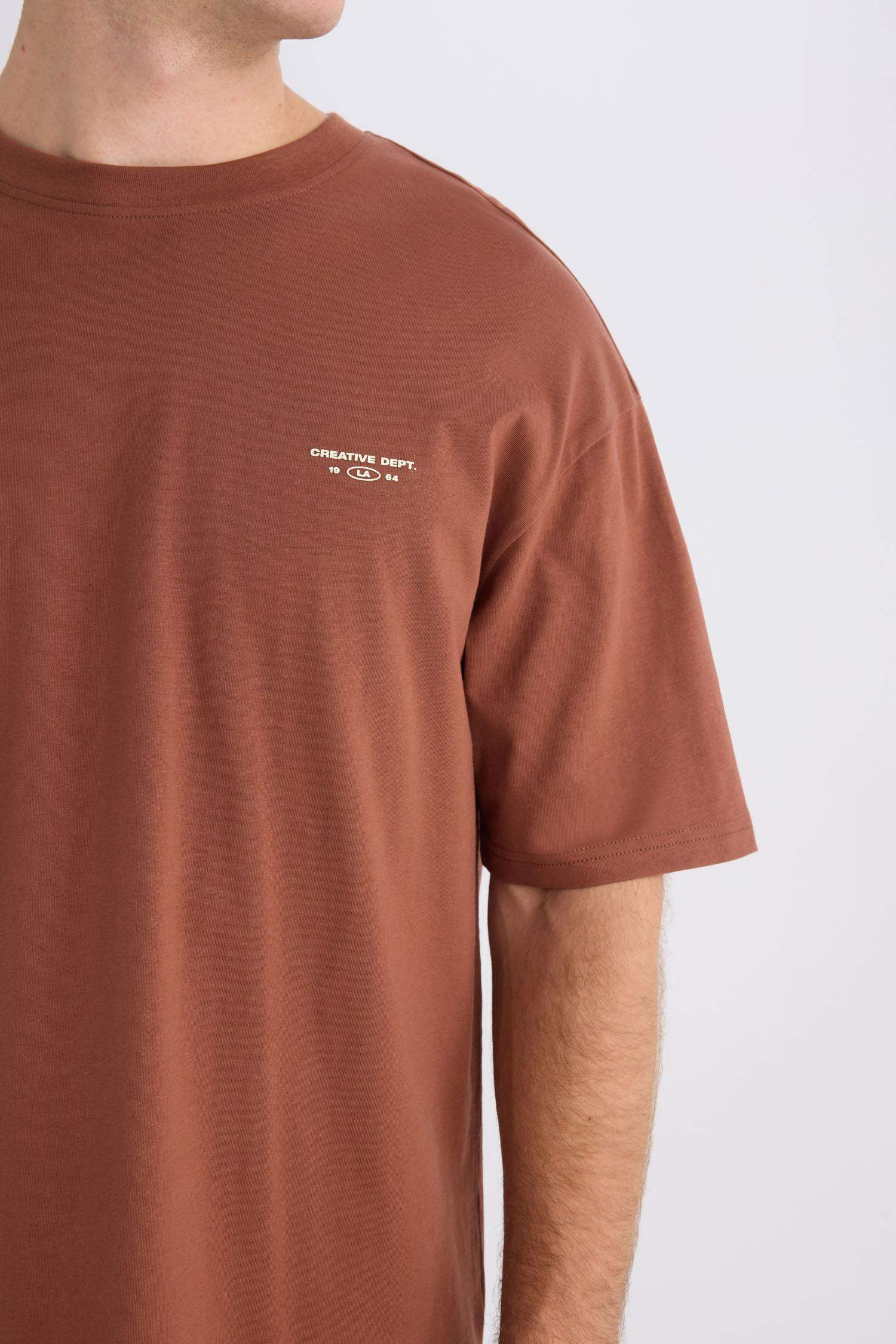 %100 Pamuk Boxy Fit Bisiklet Yaka Sırt Baskılı Kısa Kollu Tişört