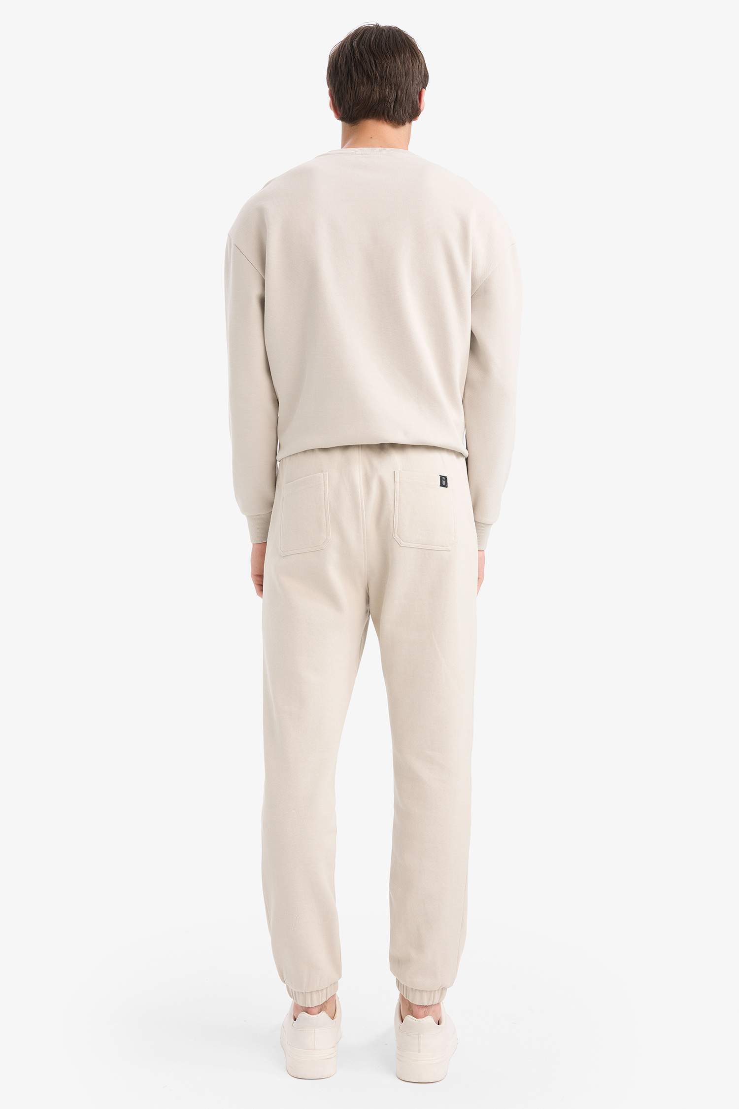 Pantalon de survêtement slim fit en piqué à poches zippées