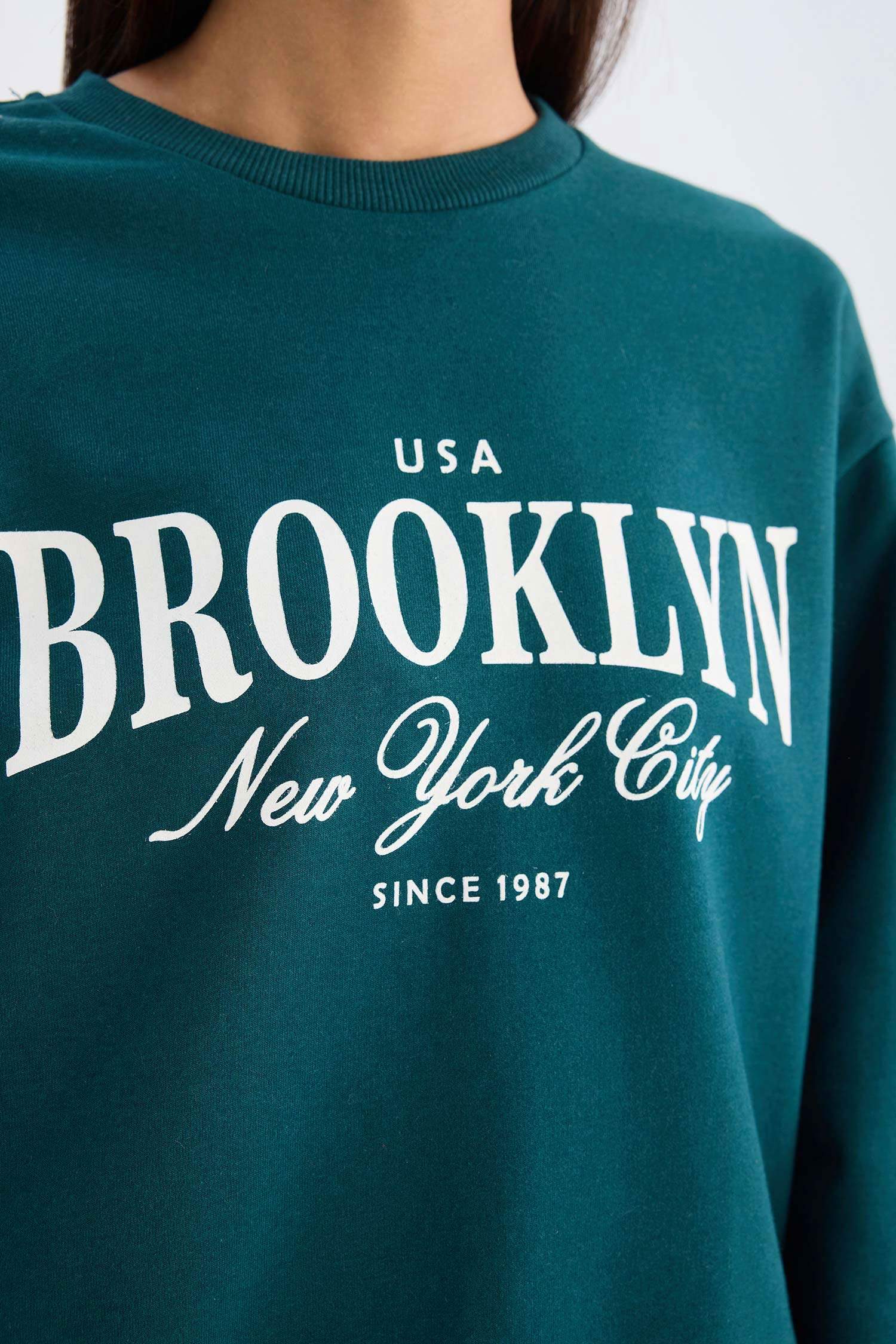 سويت شيرت قصة عادية بياخة مستديرة بطبعة