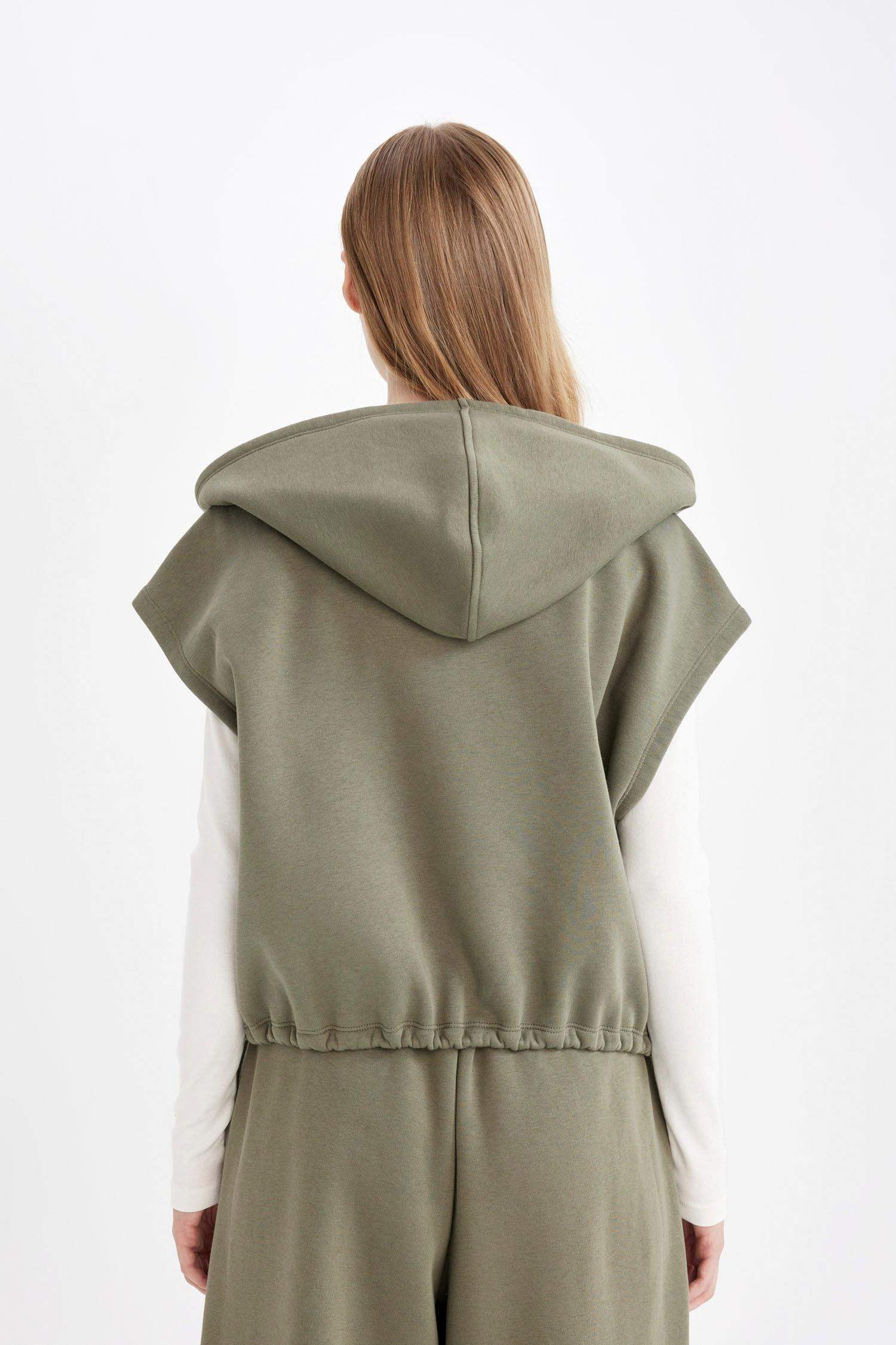 كارديجان سويت قصة فضفاضة بدون كم بسوسته