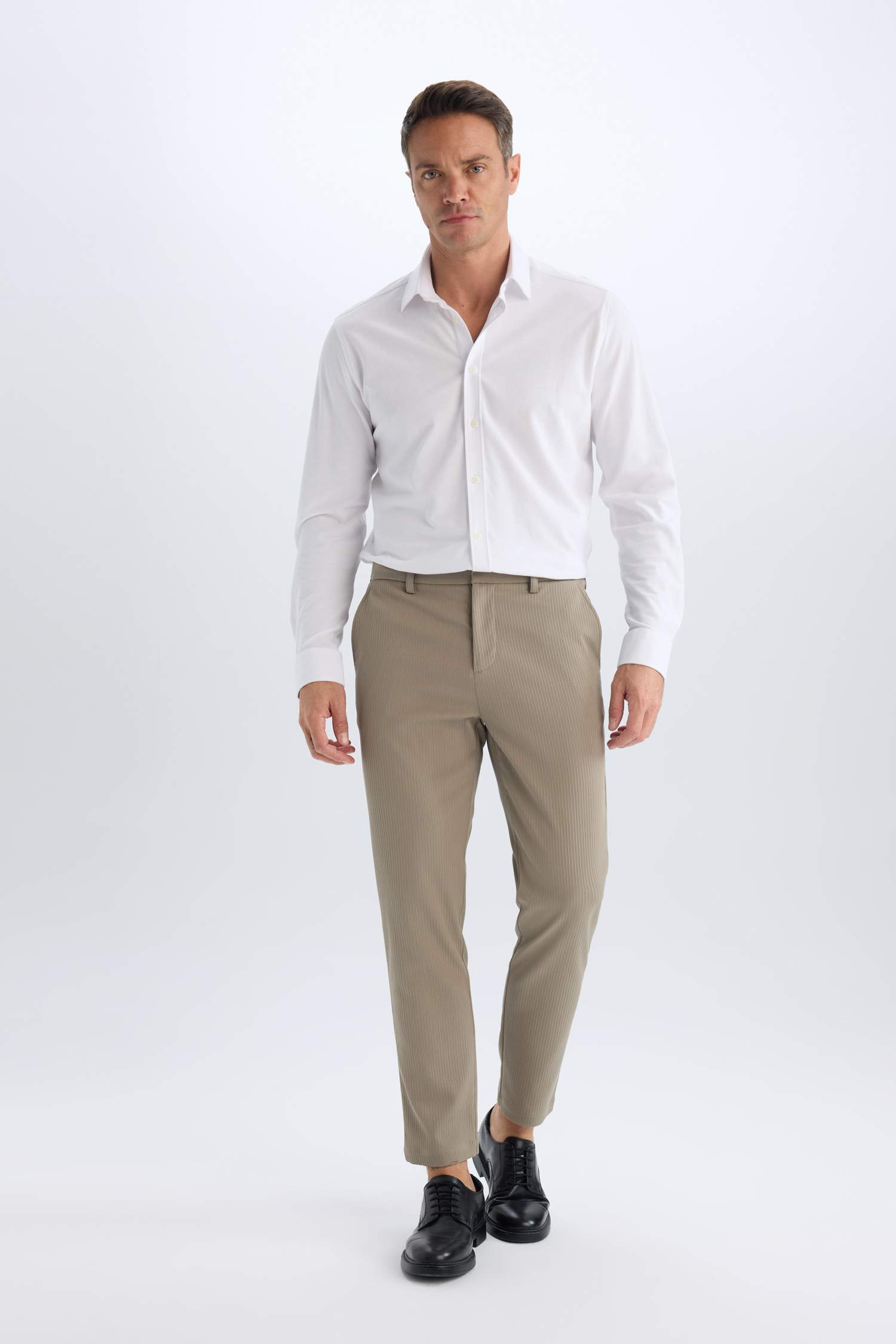 قميص بولو كم طويل محبوك قصة عادية