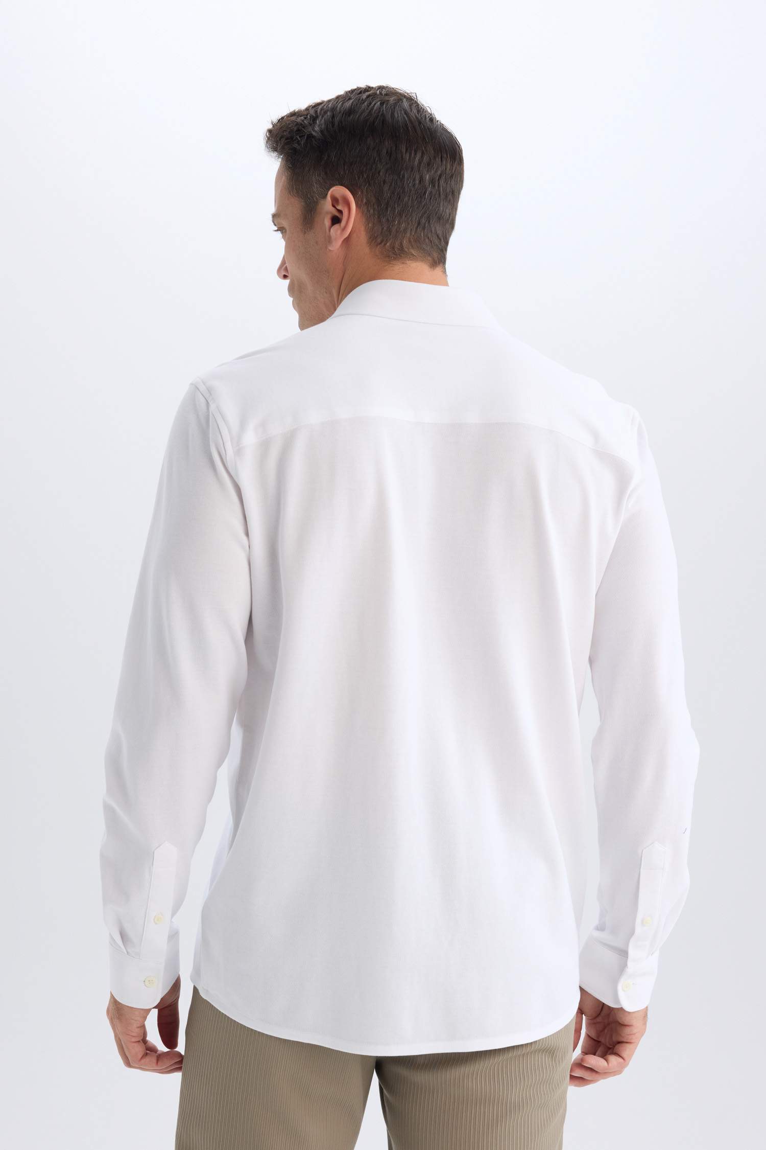 قميص بولو كم طويل محبوك قصة عادية