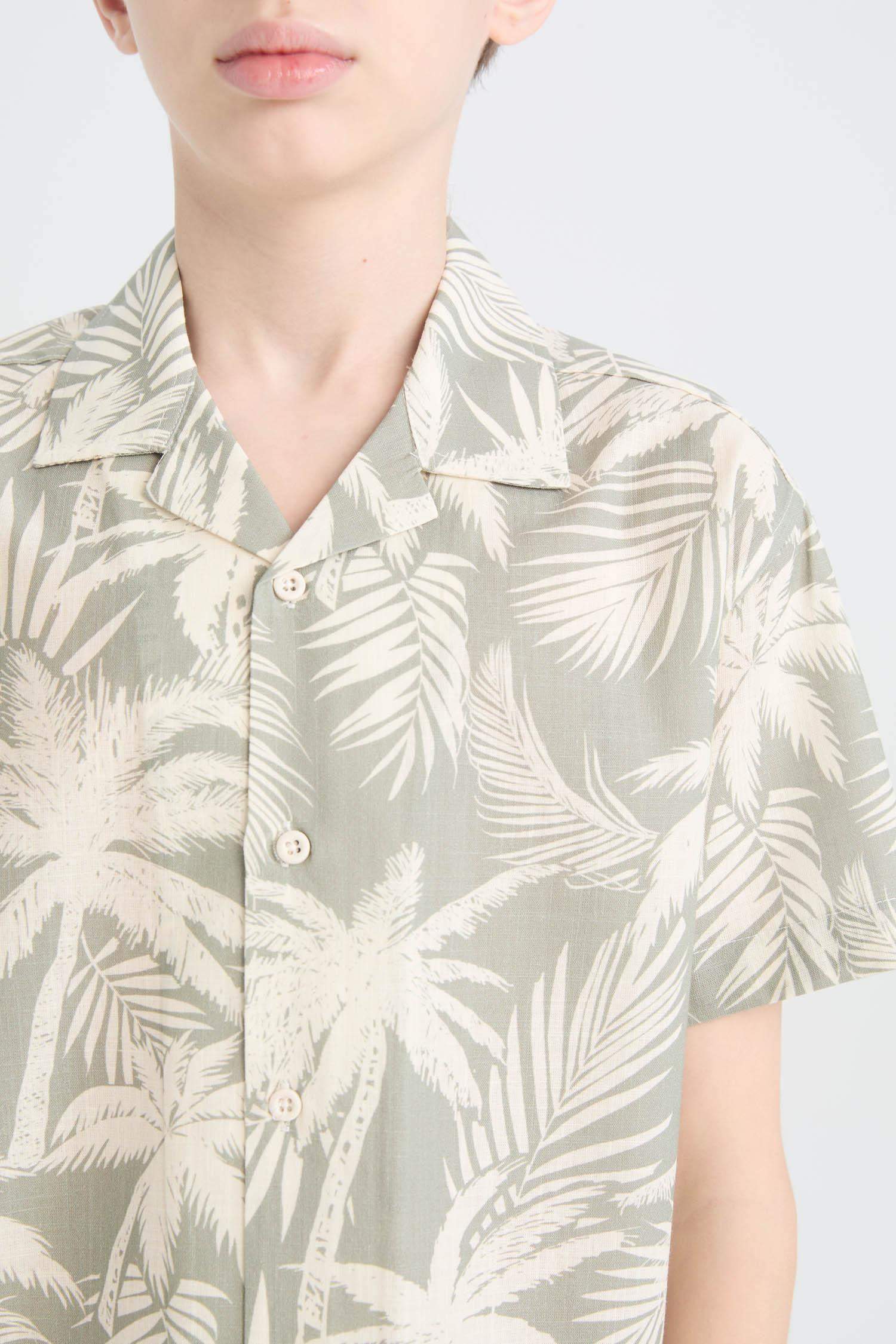 قميص بولو ولادي اوفر سايز نص ردن بطبعة نخيل