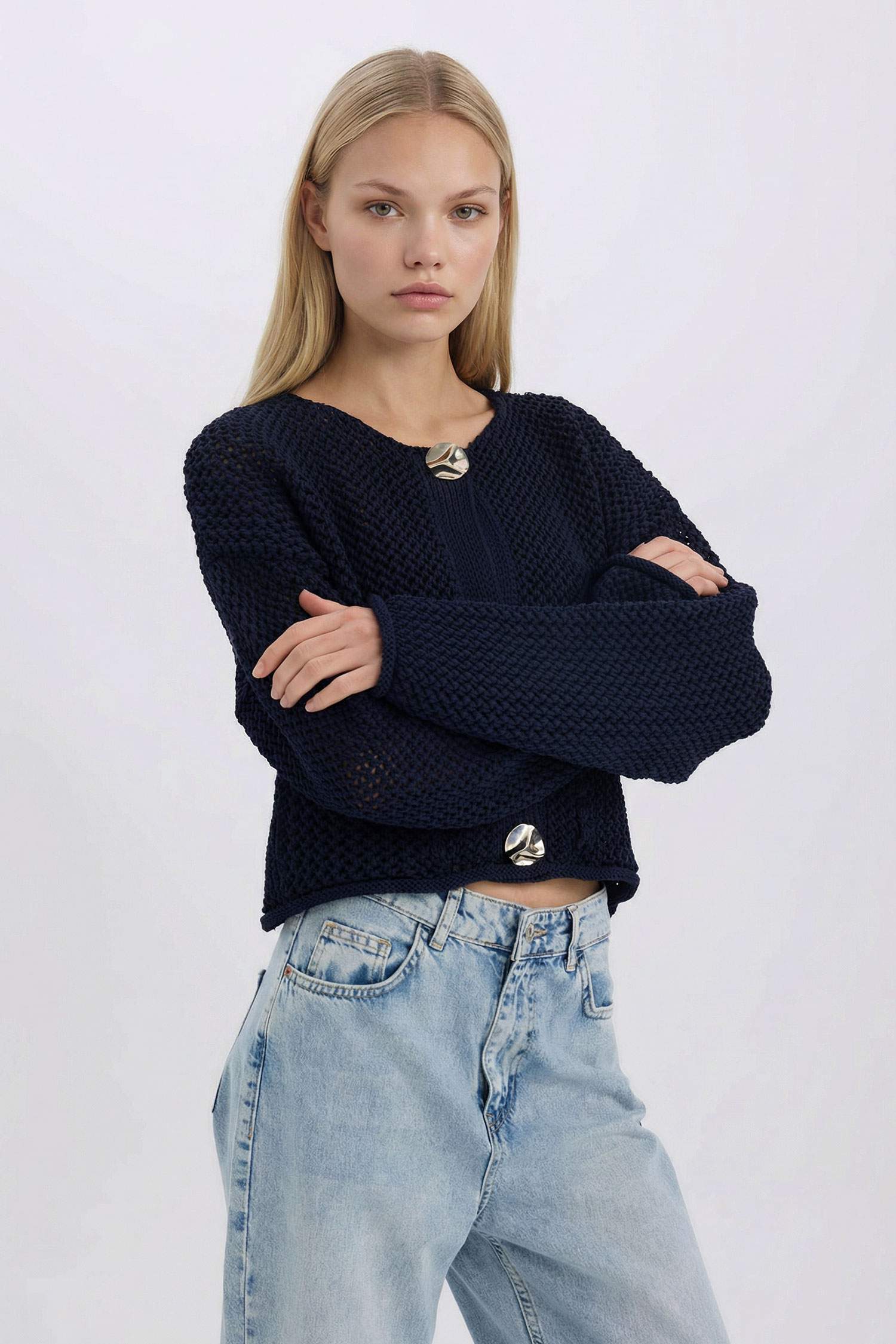Pull en tricot sans manches décontracté à col rond avec boutons et motif texturé