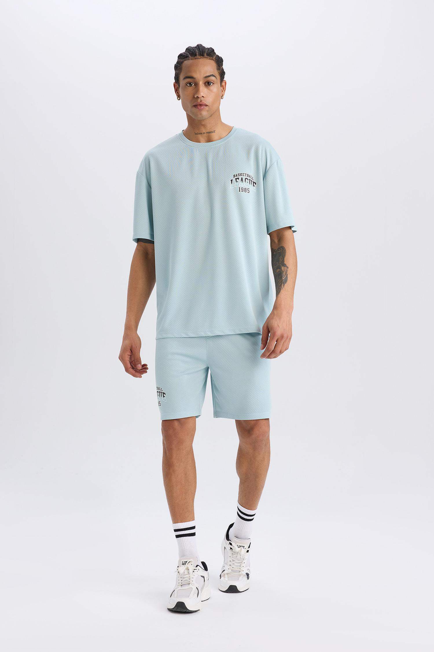 DeFactoFit شورت قصير رياضي قصة عادية مطبوع بجيب من