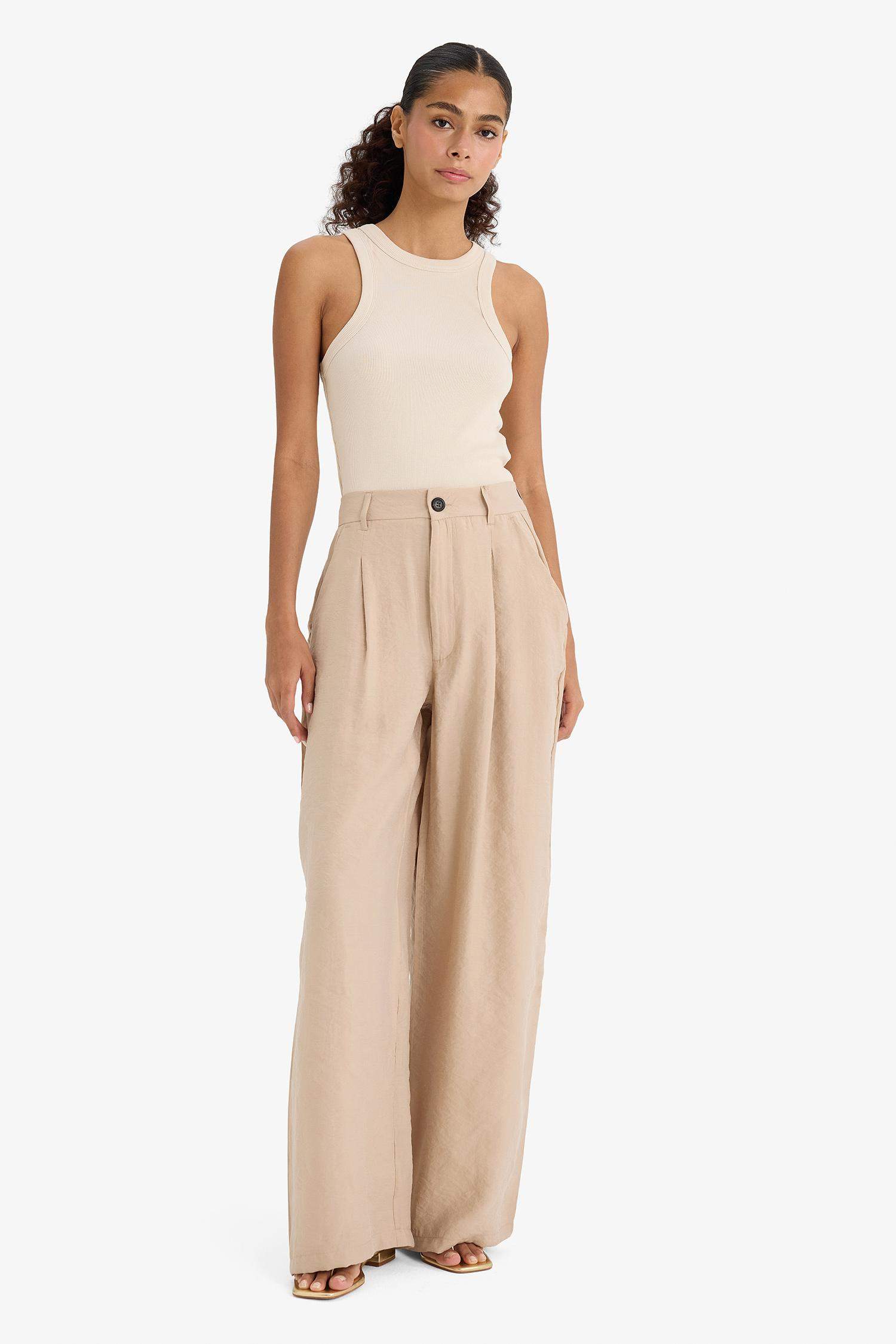 بنطرون كاروت فيت منسوج برجل واسع بجيب وخصر عالي